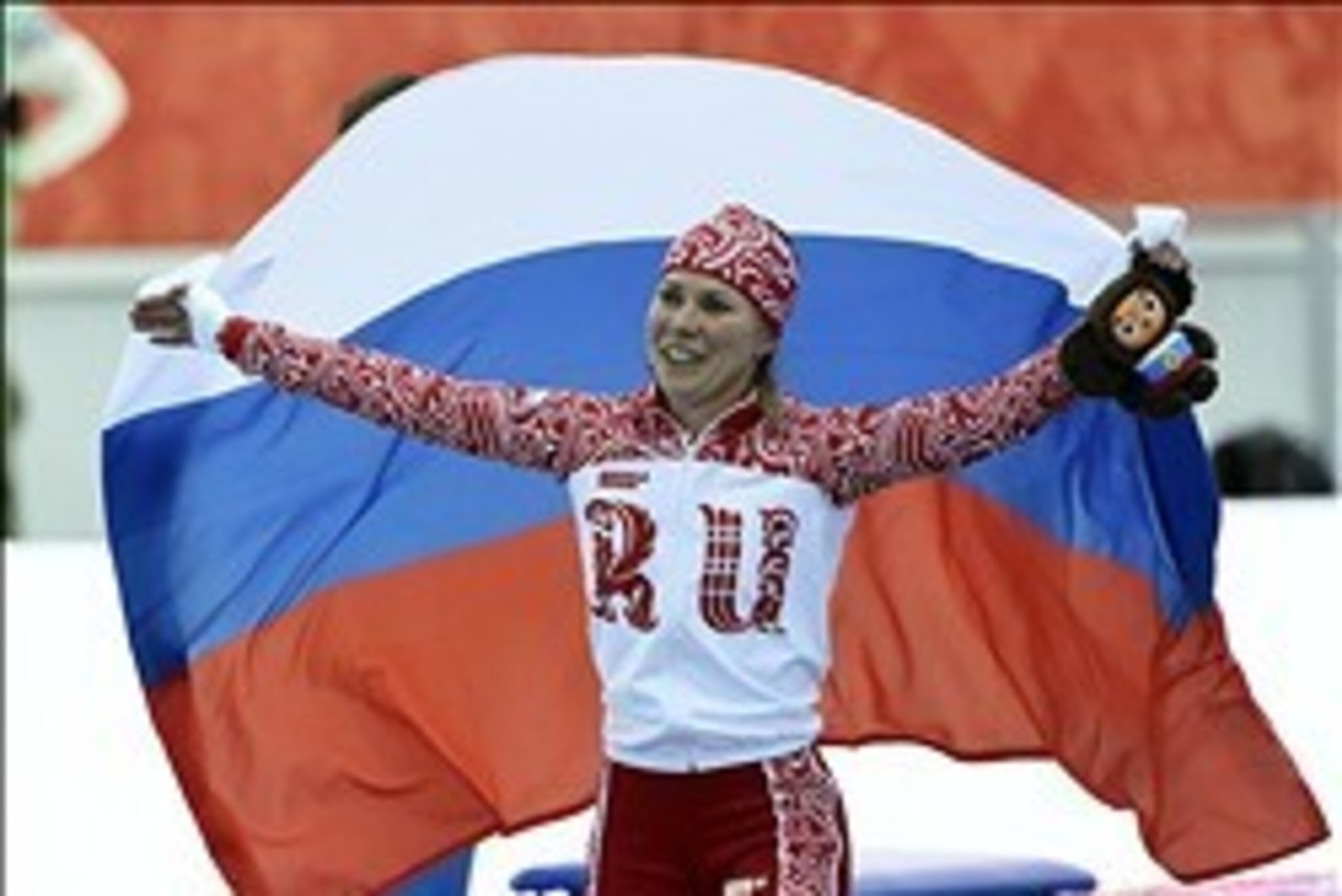 Feb 9, 2014; Sochi, RUSSIA; Olga Graf (RUS) celebrates after placing third in the ladies speedskating 3000m during the Sochi 2014 Olympic Winter Games at Adler Arena Skating Center. Mandatory Credit: Robert Hanashiro-USA TODAY Sports