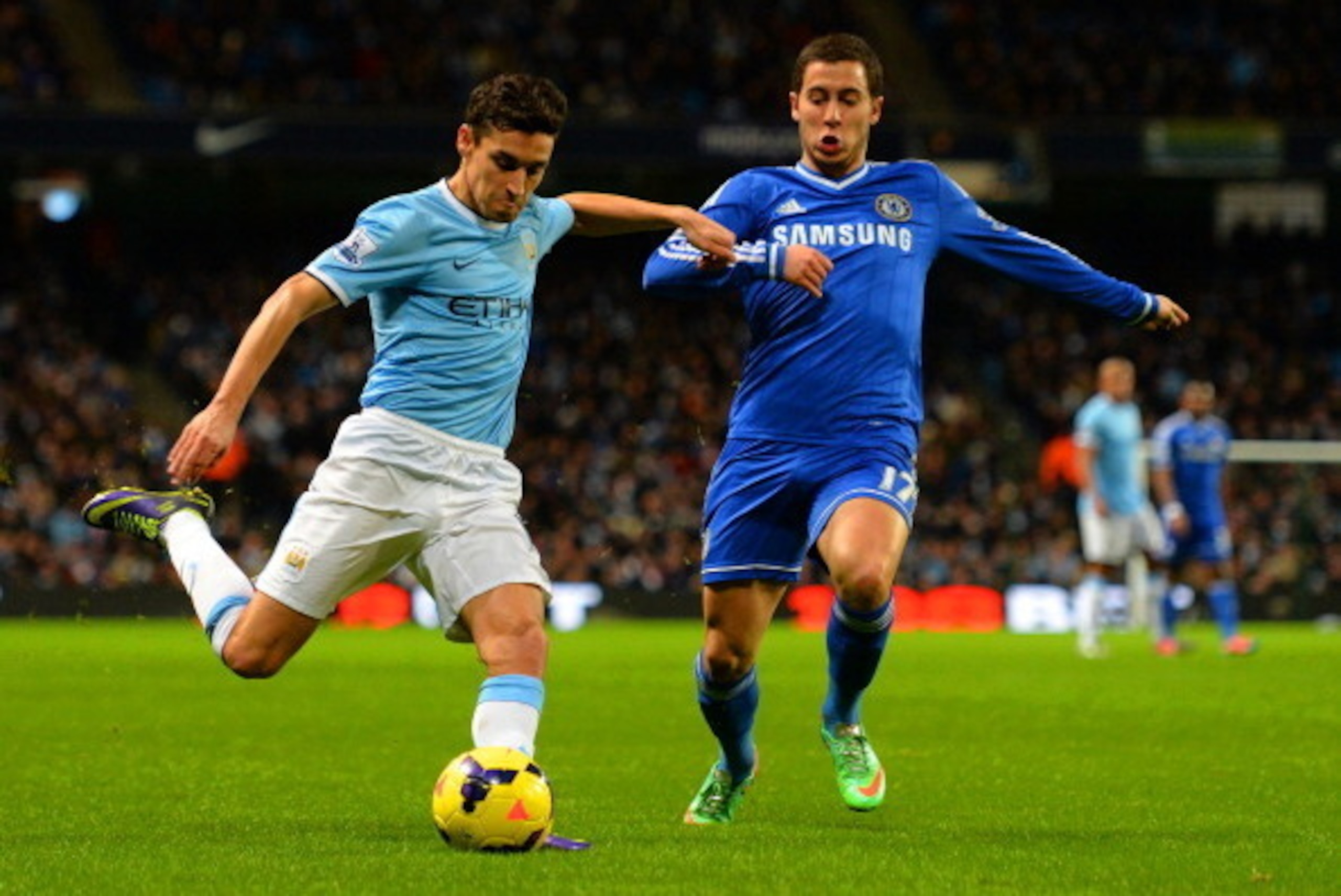MANCHESTER, ENGLAND - FEBRUARY 03:  Jesus Navas of Manchester City is closed down by Eden Hazard of Chelsea during the Barclays Premier League match between Manchester City and Chelsea at Etihad Stadium on February 3, 2014 in Manchester, England.  (Photo 