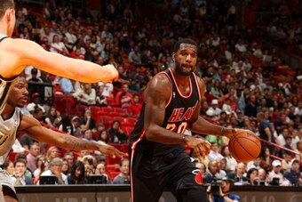 MIAMI, FL - JANUARY 26: Greg Oden #20 of the Miami Heat dribbles the ball against the San Antonio Spurs at the American Airlines Arena in Miami, Florida on Jan. 26, 2014. NOTE TO USER: User expressly acknowledges and agrees that, by downloading and/or usi