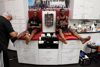 MIAMI, FL - JANUARY 26: Dwyane Wade #3 and Udonis Haslem #40 of the Miami Heat gets ready against the San Antonio Spurs at the American Airlines Arena in Miami, Florida on Jan. 26, 2014. NOTE TO USER: User expressly acknowledges and agrees that, by downlo