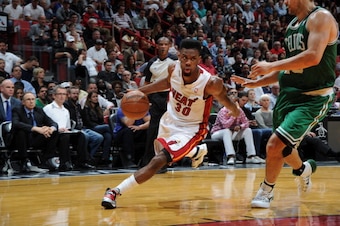 MIAMI, FL- JANUARY 21:  Norris Cole #30 of the Miami Heat handles the ball against the Boston Celtics at the American Airlines Arena in Miami, Florida on January 21, 2014.  NOTE TO USER: User expressly acknowledges and agrees that, by downloading and or u