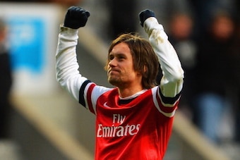 NEWCASTLE UPON TYNE, ENGLAND - DECEMBER 29: Tomas Rosicky of Arsenal celebrates victory after the Barclays Premier League match between Newcastle United and Arsenal at St James' Park on December 29, 2013 in Newcastle upon Tyne, England.  (Photo by Michael