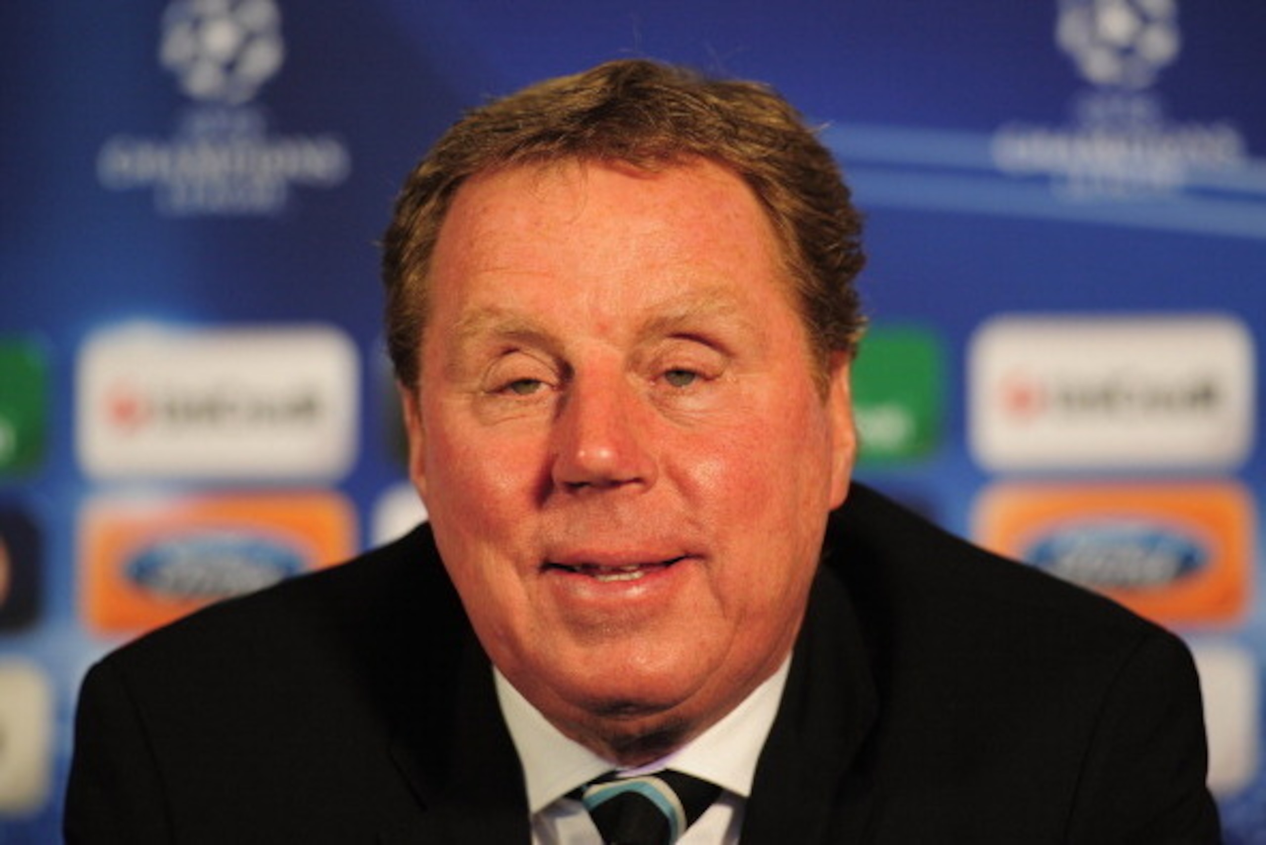 LONDON, ENGLAND - APRIL 12:  Tottenham Hotspur manager Harry Redknapp talks to the media during a press conference on the eve of their UEFA Champions League quarter-final second leg match against Real Madrid at White Hart Lane on April 12, 2011 in London,