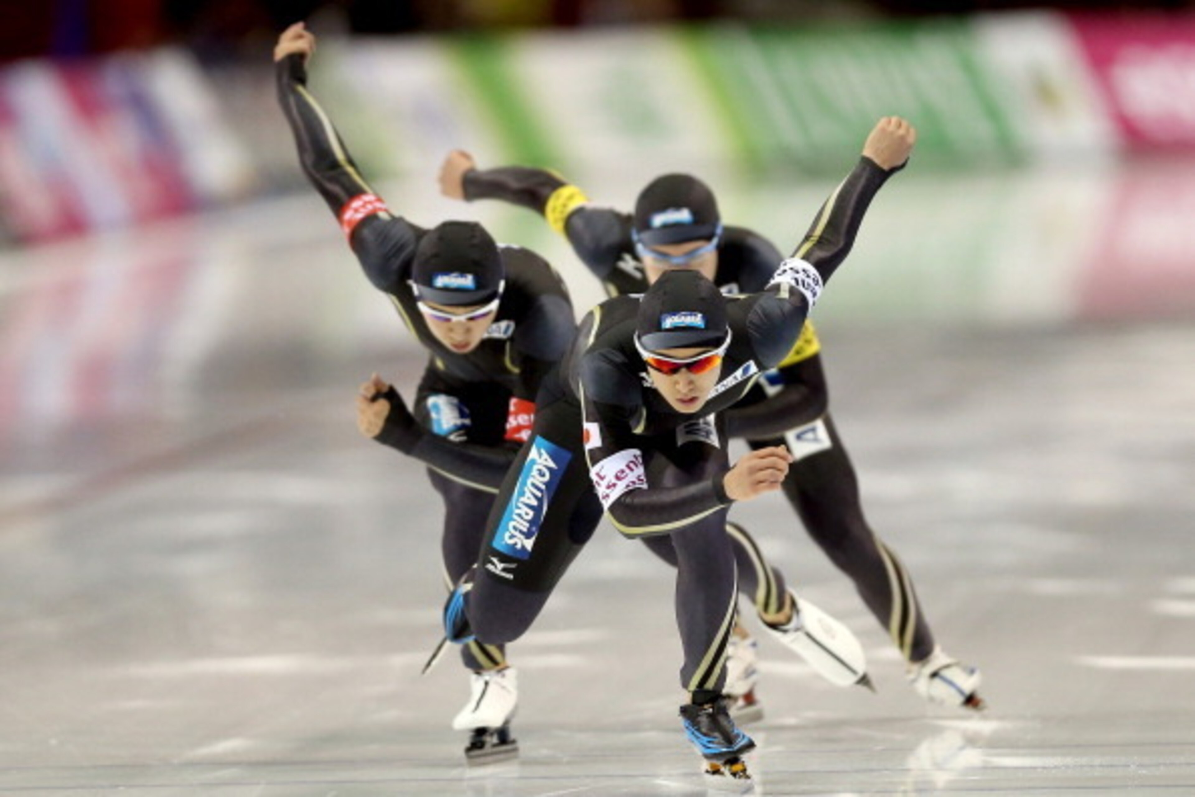 SALT LAKE CITY, UT - NOVEMBER 16:  Hiroki Abe (white armband) of Japan leads his teammates Shota Nakamura and Shane Williamsson in the men's Team Pursuit during the Essent ISU Long Track World Cup at the Utah Olympic Oval on November 16, 2013 in Salt Lake
