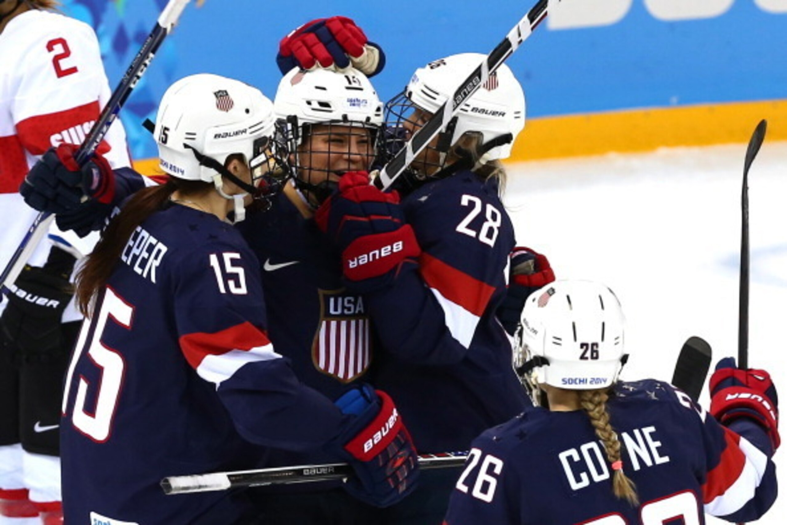 SOCHI, RUSSIA - FEBRUARY 10:  Amanda Kessel #28 of United States and Brianna Decker #14 of United States celebrate a goal with team-mates during the Women's Ice Hockey Preliminary Round Group A game against Switzerland on day three of the Sochi 2014 Winte