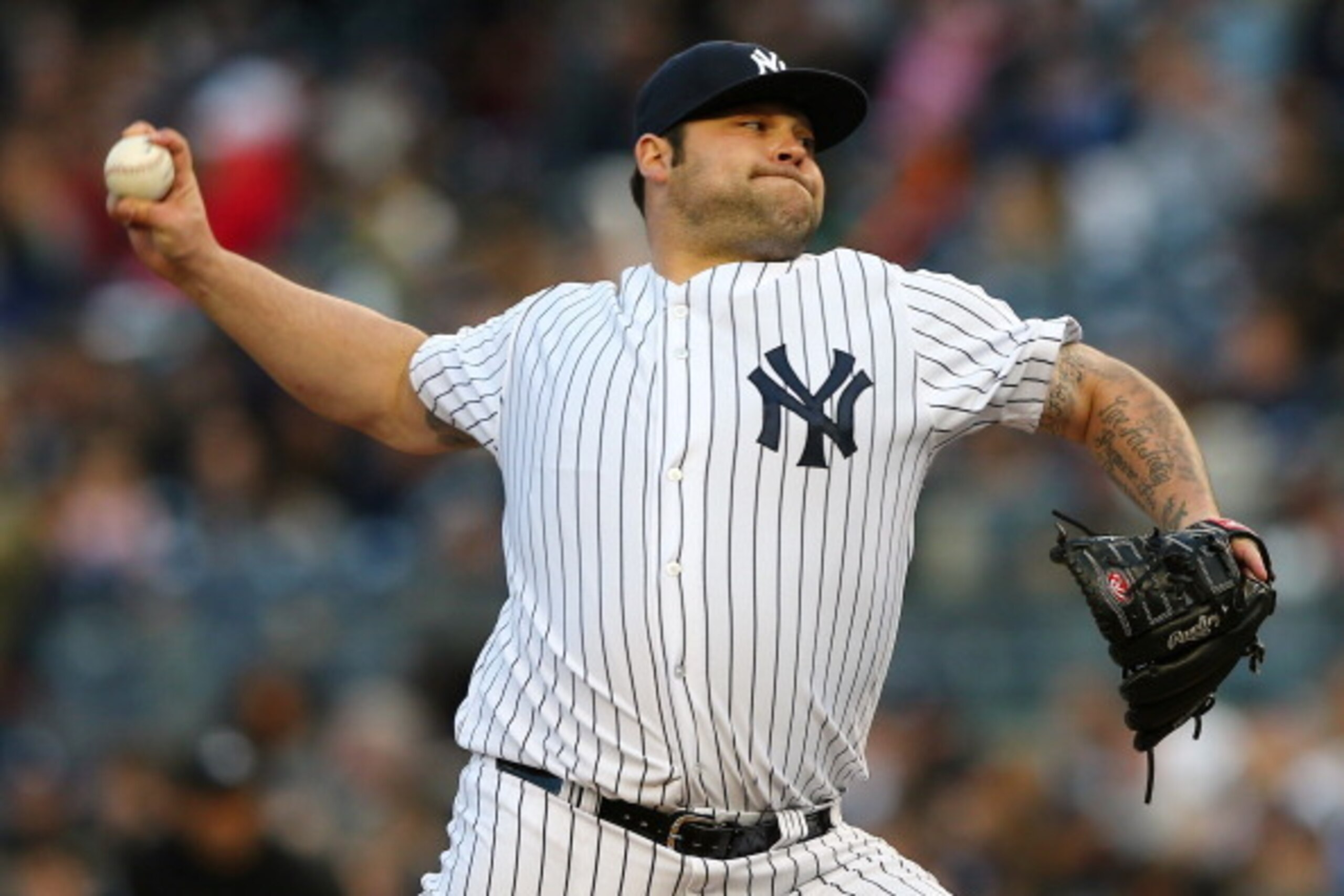 NEW YORK, NY - APRIL 13:  Joba Chamberlain #62 of the New York Yankees delivers a pitch in the eighth inning against the Baltimore Orioles on April 13, 2013 at Yankee Stadium in the Bronx borough of New York City.The Baltimore Orioles defeated the New Yor