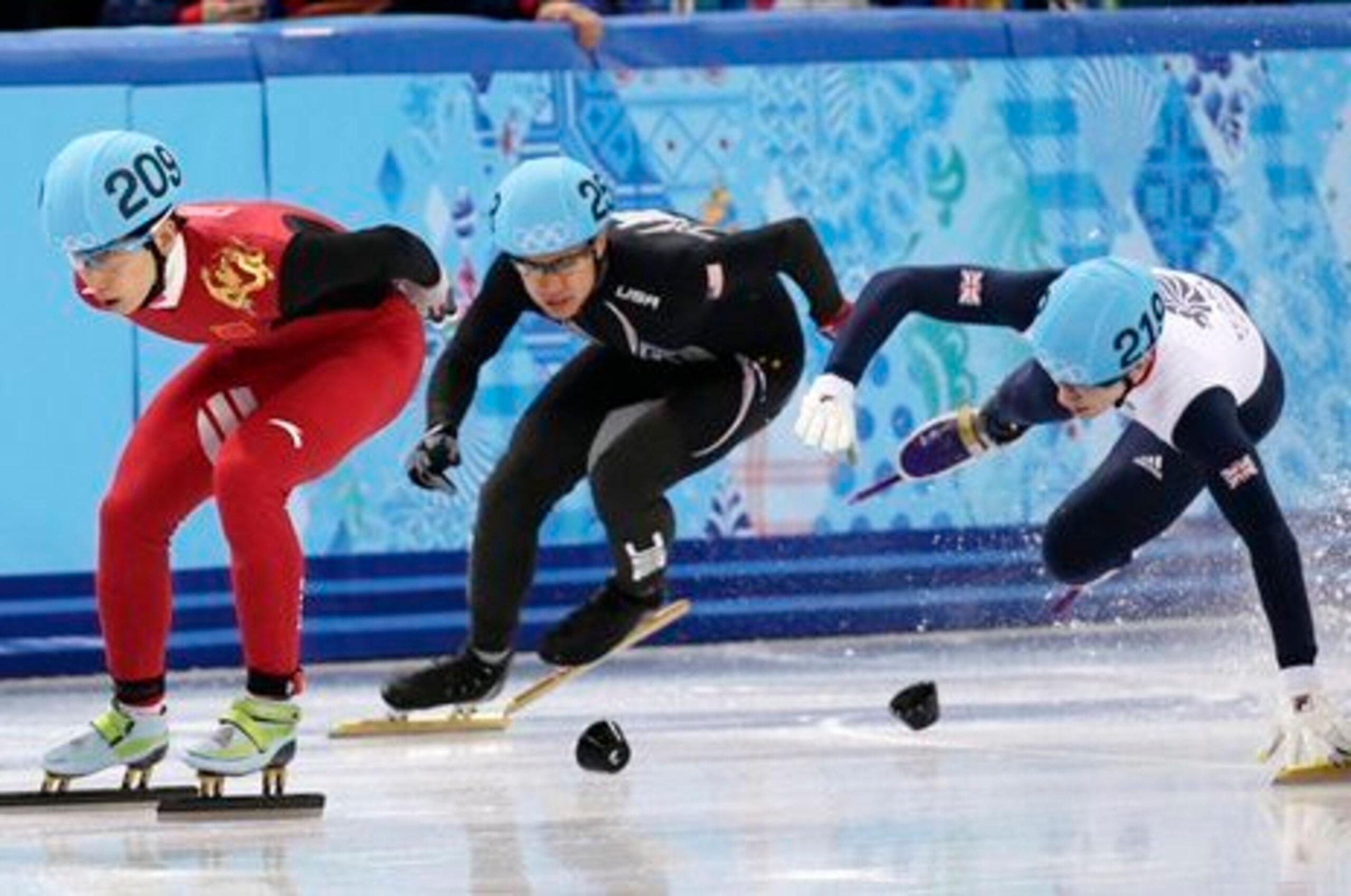 J.R. Celski (center) made a move, but failed to medal.