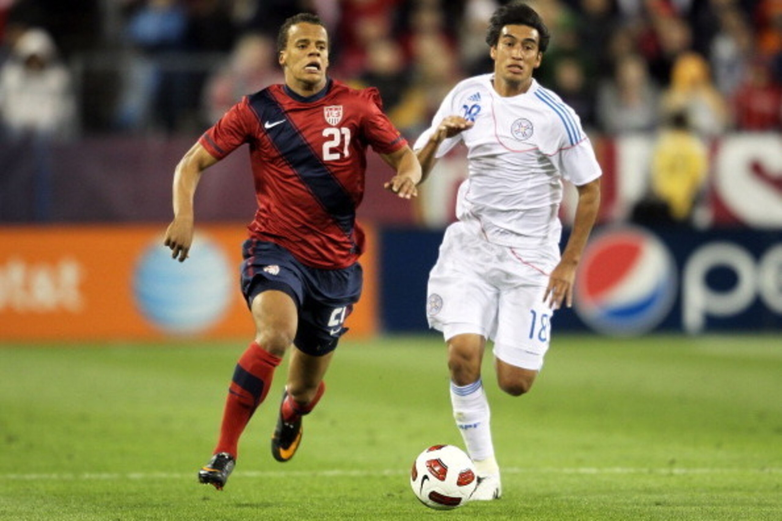 NASHVILLE, TN - MARCH 29:  Timothy Chandler #21 of the United States controls the ball while defended by Marcelo Estigarribia #18 of Paraguay during an international friendly match at LP Field on March 29, 2011 in Nashville, Tennessee.  (Photo by Andy Lyo