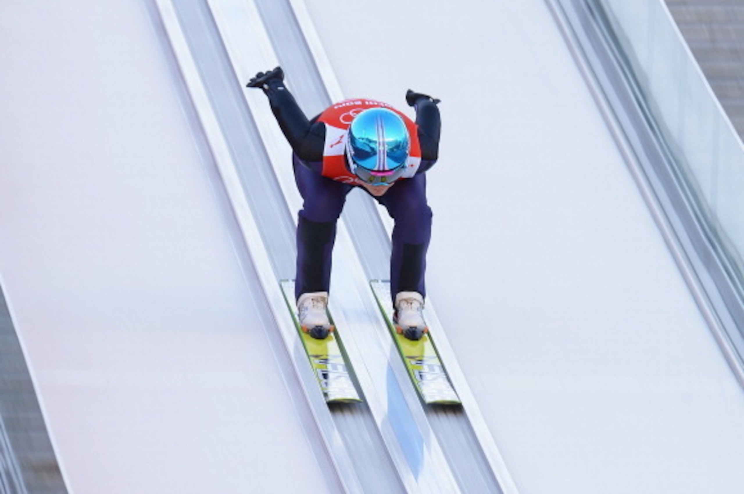 SOCHI, RUSSIA - FEBRUARY 08: Carina Vogt of Germany jumps during the Ladies' Normal Hill Individual Ski Jumping training on day 1 of the Sochi 2014 Winter Olympics at the RusSki Gorki Ski Jumping Center on February 8, 2014 in Sochi, Russia.  (Photo by Lar