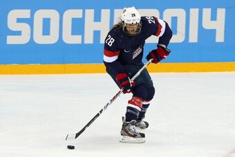 SOCHI, RUSSIA - FEBRUARY 08:  Amanda Kessel #28 of United States skates with the puck against Finland during the Women's Ice Hockey Preliminary Round Group A Game on day 1 of the Sochi 2014 Winter Olympics at Shayba Arena on February 8, 2014 in Sochi, Rus