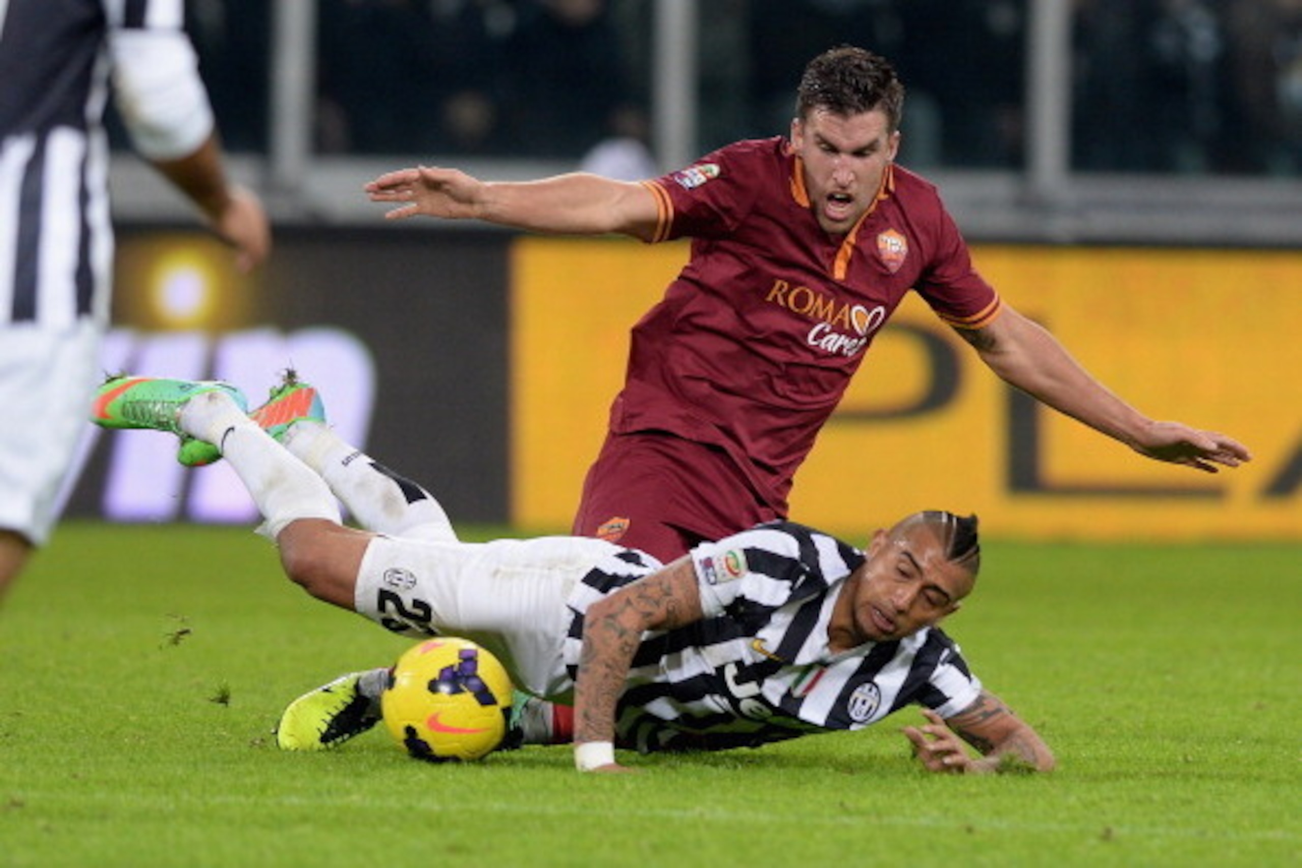 TURIN, ITALY - JANUARY 05: Arturo Vidal of FC Juventus falls in front of Kevin Strootman of AS Roma during the Serie A match between Juventus and AS Roma at Juventus Arena on January 5, 2014 in Turin, Italy. (Photo by Claudio Villa/Getty Images) TURIN, ITALY - JANUARY 05: Arturo Vidal of FC Juventus falls in front of Kevin Strootman of AS Roma during the Serie A match between Juventus and AS Roma at Juventus Arena on January 5, 2014 in Turin, Italy. (Photo by Claudio Villa/Getty Images)