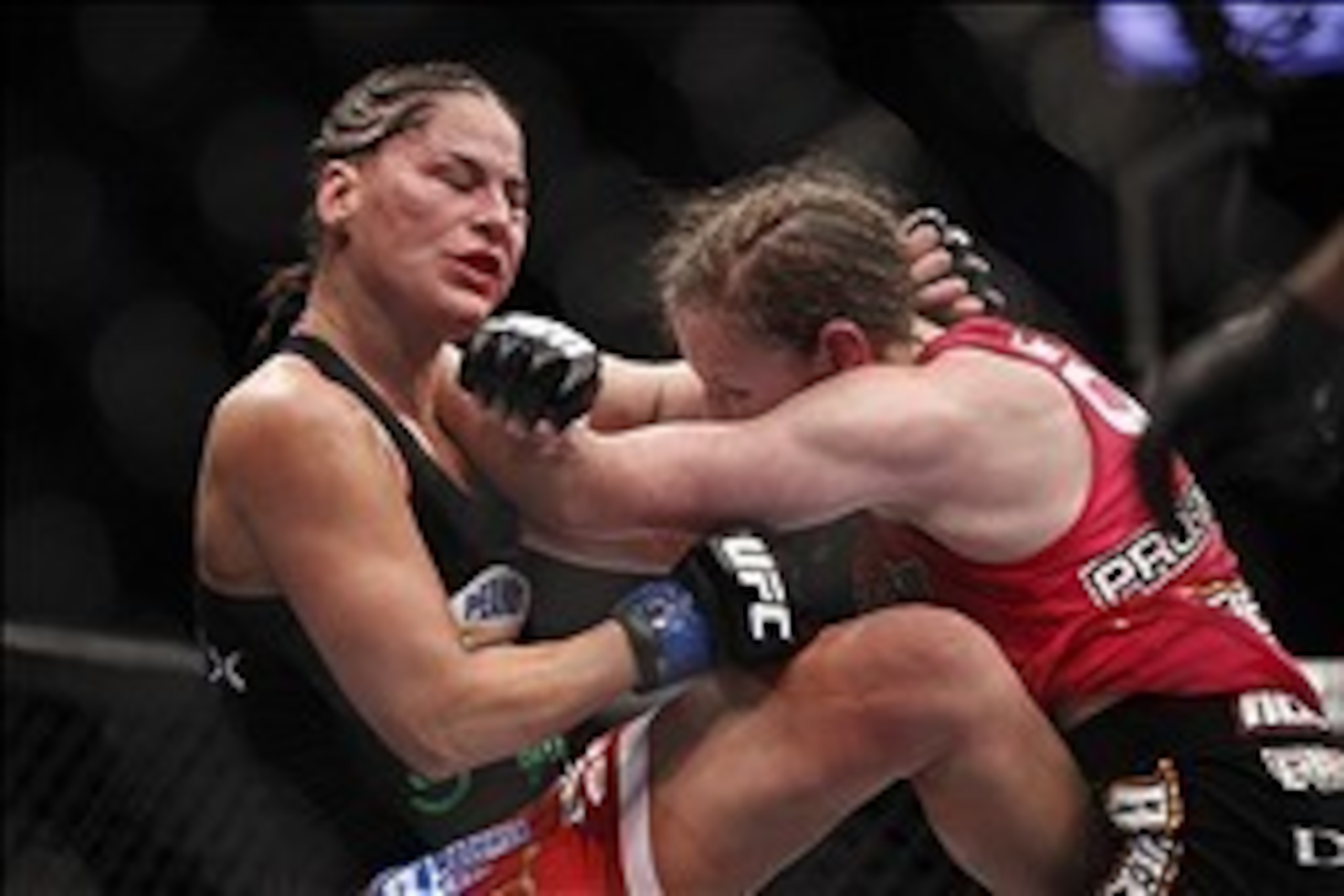 Oct 19, 2013; Houston, TX, USA; Sarah Kaufman (red gloves) fights against Jessica Eye (blue gloves) in their women's bantamweight bout during UFC 166 at Toyota Center. Mandatory Credit: Andrew Richardson-USA TODAY Sports