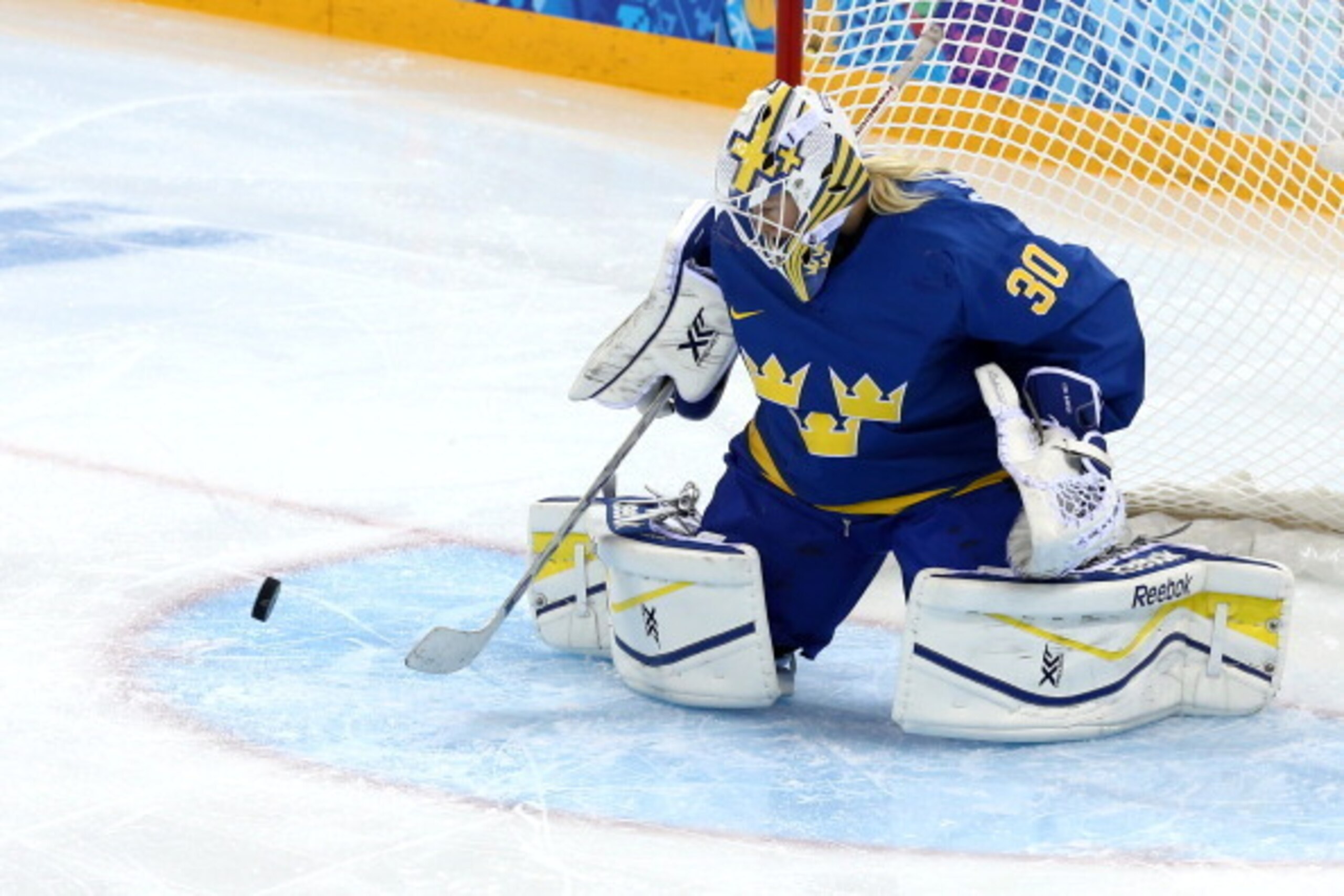 SOCHI, RUSSIA - FEBRUARY 11: Kim Martin Hasson #30 of Sweden makes a save during the Women's Ice Hockey Preliminary Round Group B game on day four of the Sochi 2014 Winter Olympics at Shayba Arena on February 11, 2014 in Sochi, Russia.  (Photo by Martin R