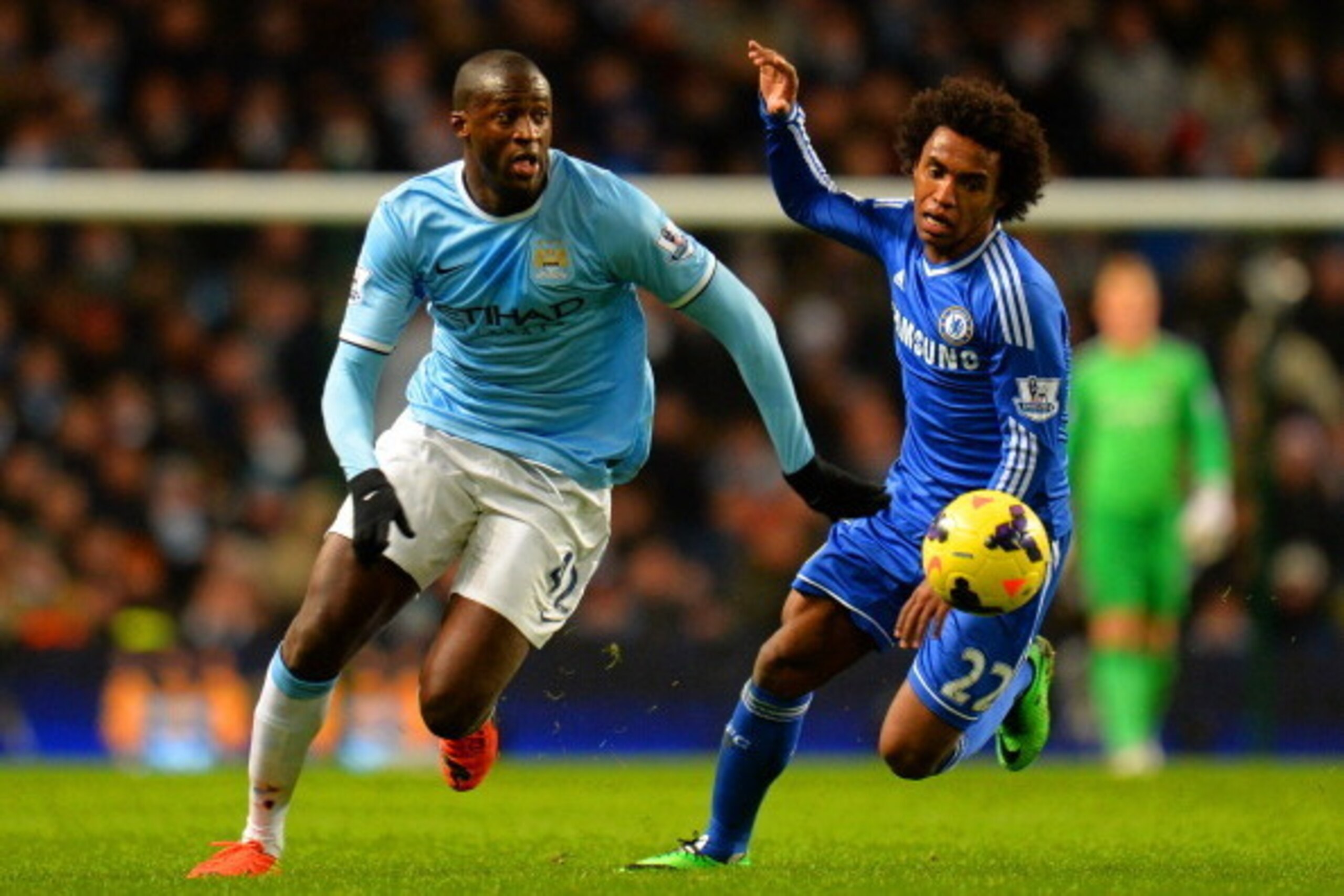 MANCHESTER, ENGLAND - FEBRUARY 03:  Willian of Chelsea marshalls Yaya Toure of Manchester City during the Barclays Premier League match between Manchester City and Chelsea at Etihad Stadium on February 3, 2014 in Manchester, England.  (Photo by Shaun Bott