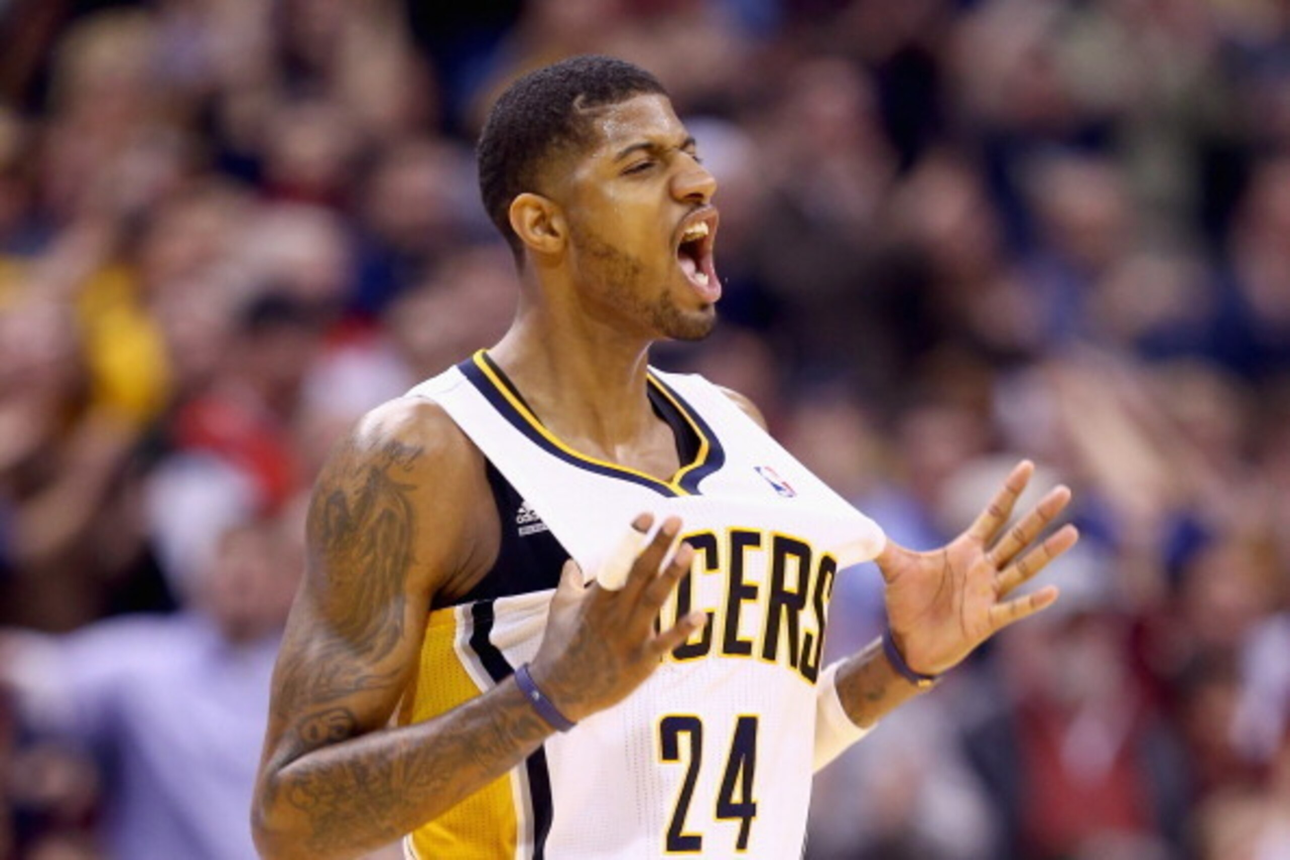 INDIANAPOLIS, IN - FEBRUARY 07:  Paul George#24 of the Indiana Pacers  celebrates during overtime in the118-113 win over the Portland Trailblazers  at Bankers Life Fieldhouse on February 7, 2014 in Indianapolis, Indiana.  NOTE TO USER: User expressly ackn
