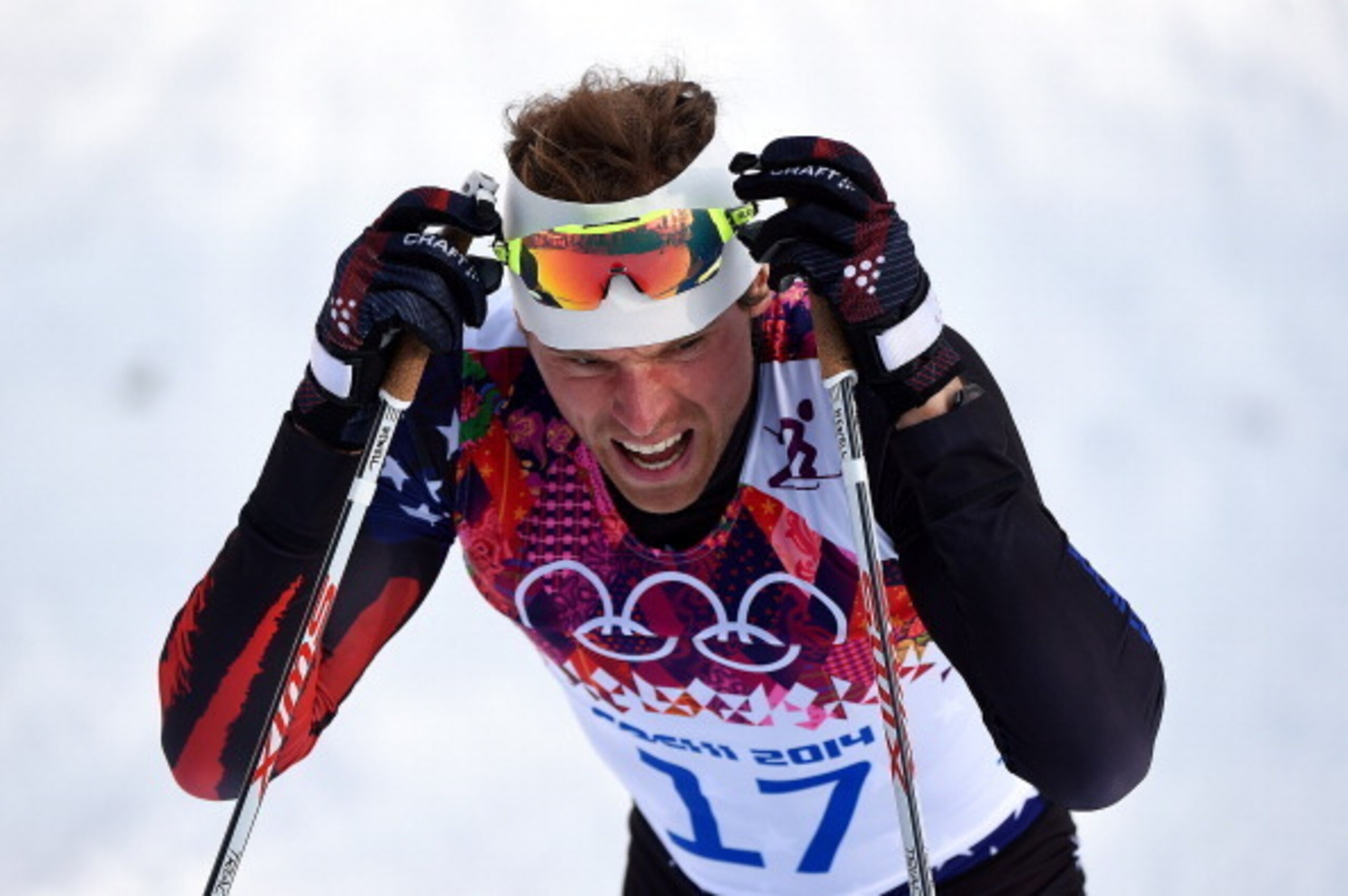 SOCHI, RUSSIA - FEBRUARY 11:  Andrew Newell of the United States crosses the finish line in the Finals of the Men's Sprint Free during day four of the Sochi 2014 Winter Olympics at Laura Cross-country Ski & Biathlon Center on February 11, 2014 in Sochi, R