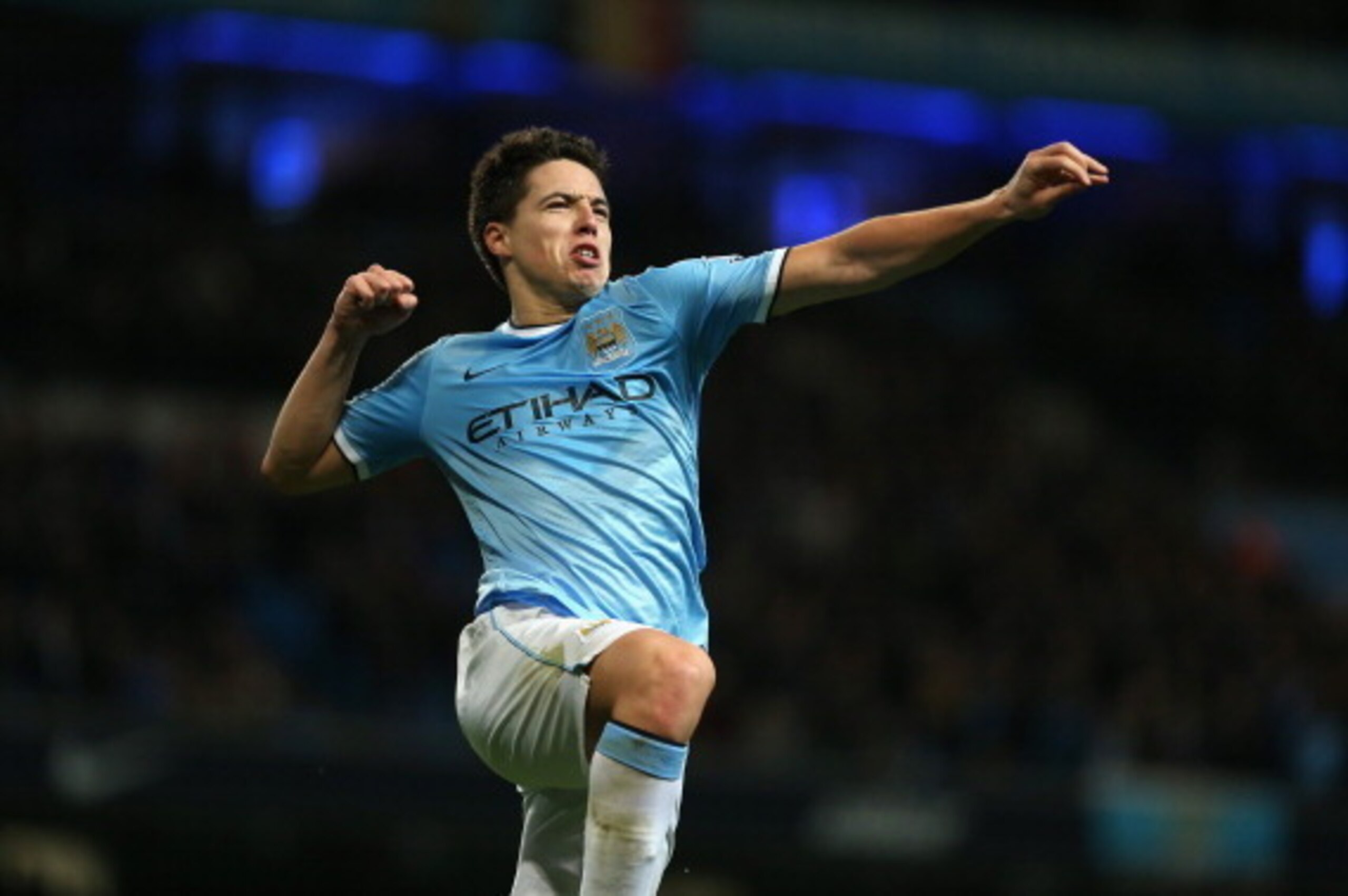 MANCHESTER, ENGLAND - DECEMBER 01:  Samir Nasri of Manchester City celebrates after scoring his second goal (Citys third) during the Barclays Premier League match between Manchester City and Swansea City at the Etihad Stadium on December 1, 2013 in Manche