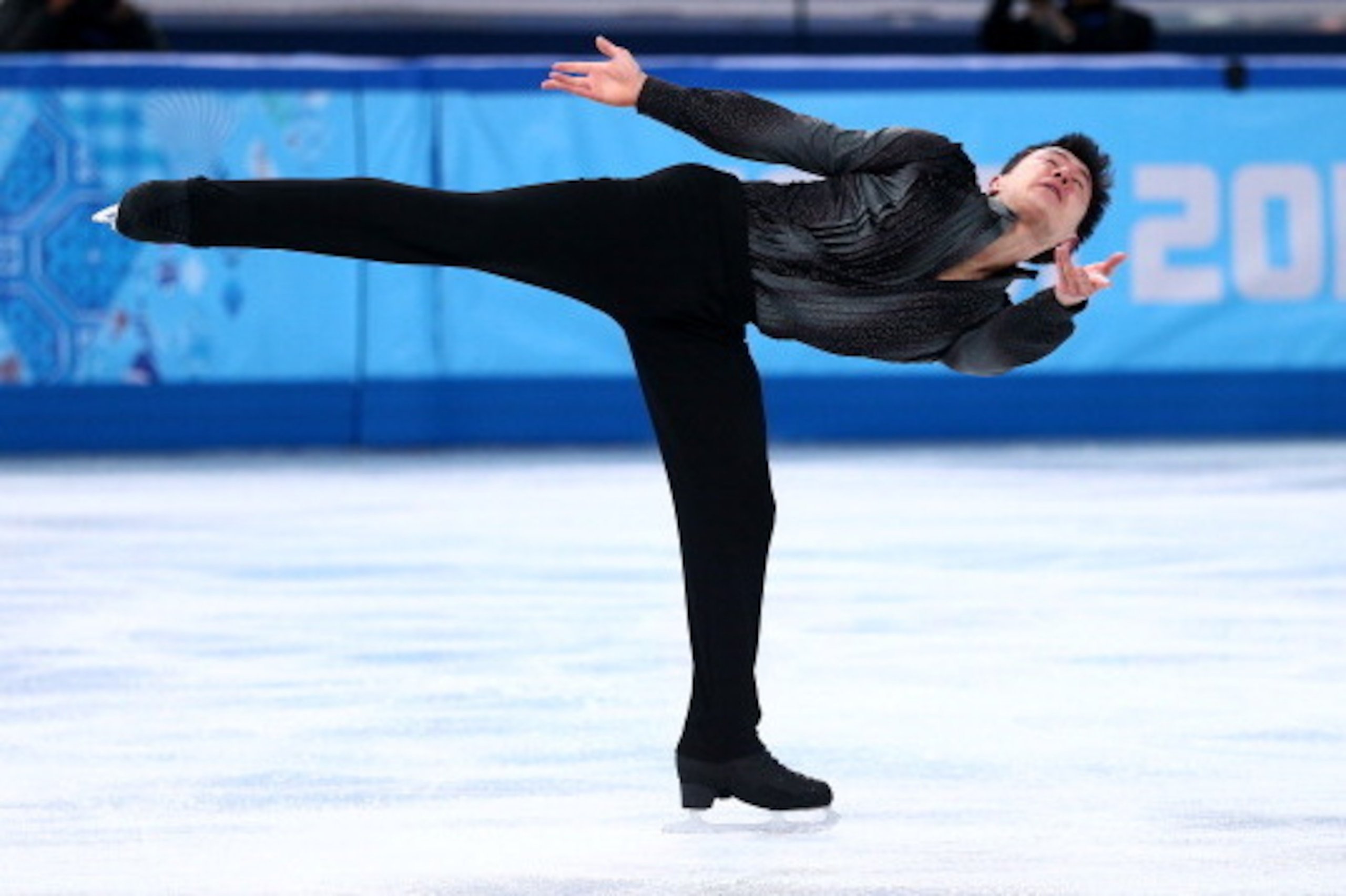 SOCHI, RUSSIA - FEBRUARY 06:  Patrick Chan of Canada competes in the Figure Skating Men's Short Program during the Sochi 2014 Winter Olympics at Iceberg Skating Palace on February 6, 2014 in Sochi, Russia.  (Photo by Clive Mason/Getty Images)
