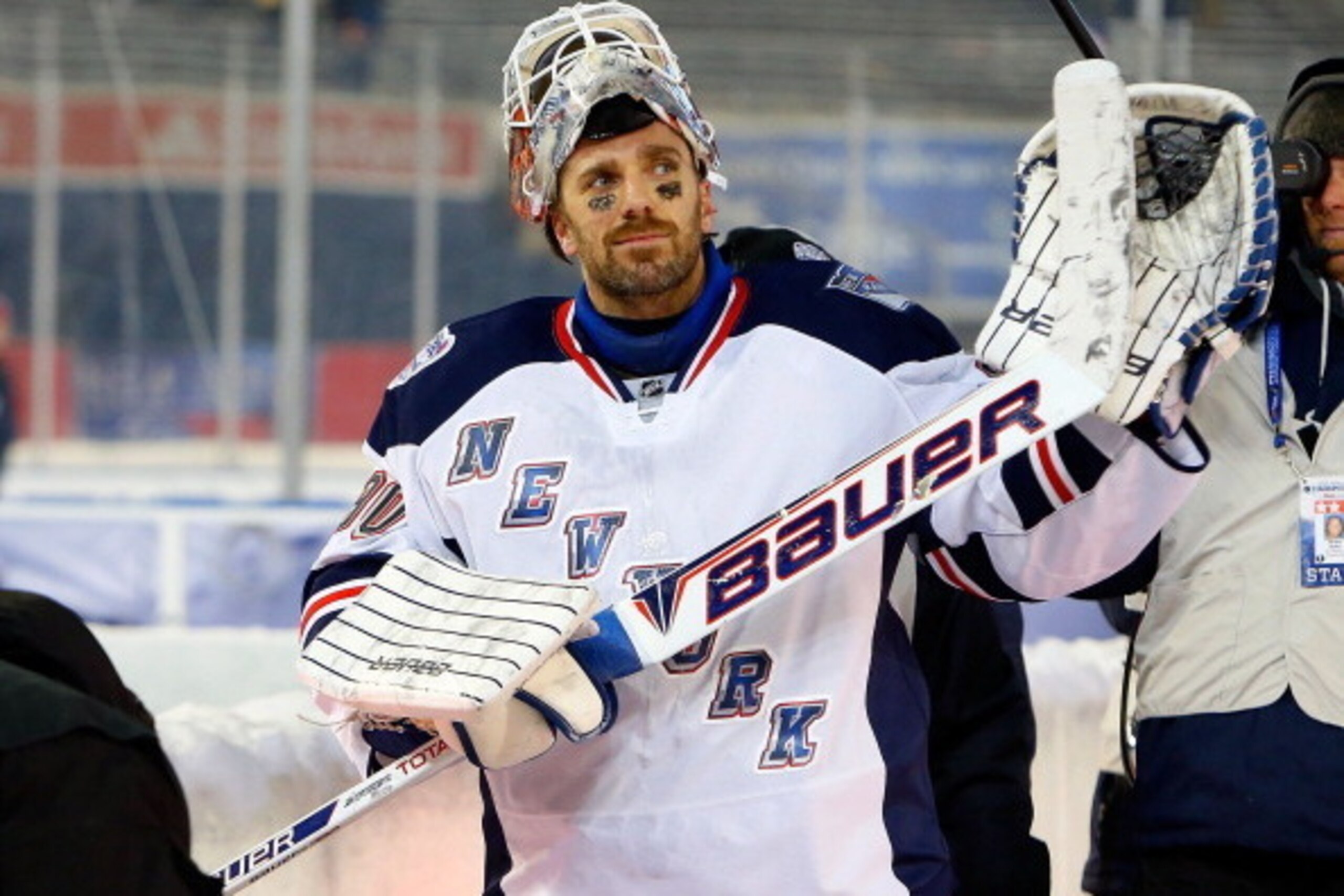 NEW YORK, NY - JANUARY 29:  (EDITORIAL USE ONLY)  Henrik Lundqvist #30 of the New York Rangers walks off the ice after deafeating the New York Islanders during the 2014 Coors Light NHL Stadium Series at Yankee Stadium on January 29, 2014 in the Bronx boro