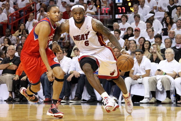 MIAMI, FL - APRIL 27:  LeBron James #6 of the Miami Heat drives by Evan Turner #12 of the Philadelphia 76ers during game five of the Eastern Conference Quarterfinals in the 2011 NBA Playoffs at American Airlines Arena on April 27, 2011 in Miami, Florida. 