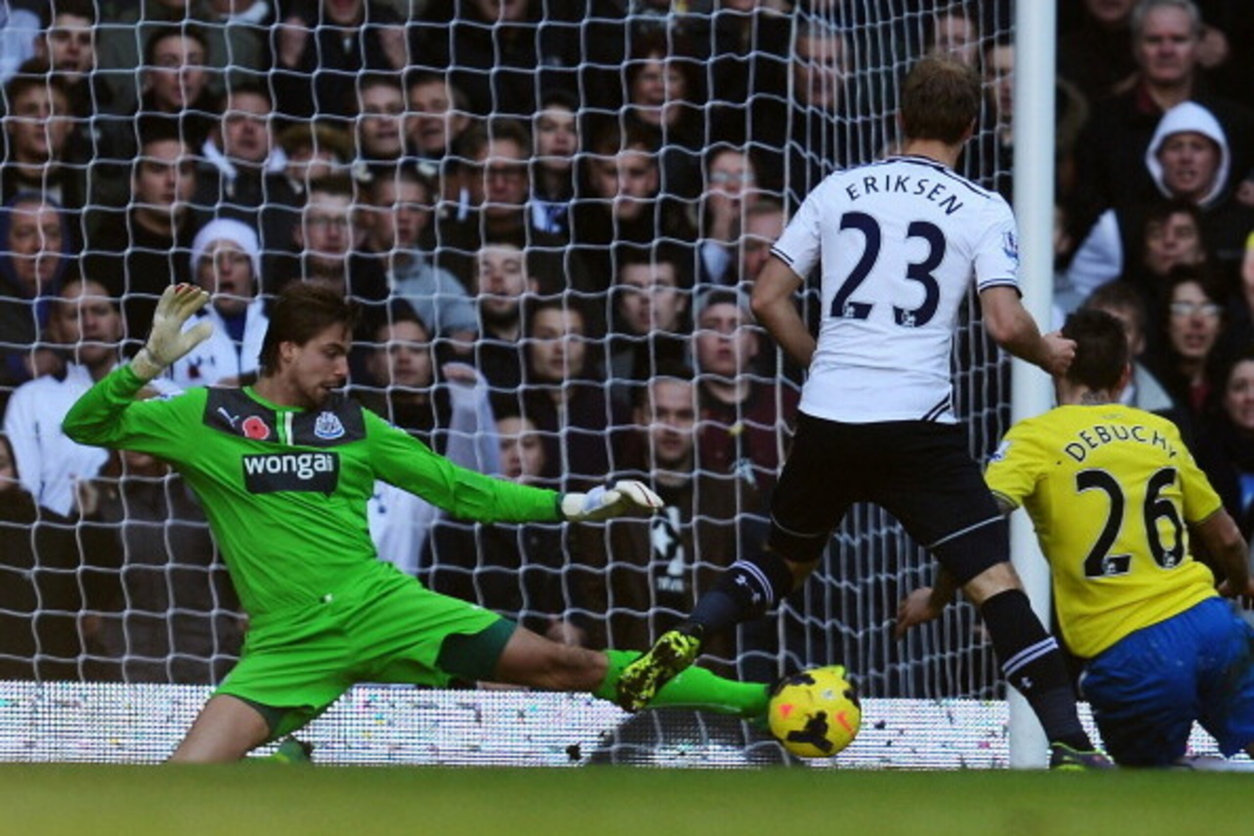 LONDON, ENGLAND - NOVEMBER 10:  Tim Krul the Newcastle United goalkeeper makes a save under pressure from Christian Eriksen of Tottenham Hotspur during the Barclays Premier League match between Tottenham Hotspur and Newcastle United at White Hart Lane on 