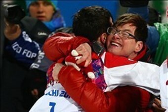 Feb 10, 2014; Krasnaya Polyana, RUSSIA; Alex Bilodeau (CAN) hugs his brother Frederic Bilodeau after winning gold in men's moguls finals during the Sochi 2014 Olympic Winter Games at Rosa Khutor Extreme Park. Mandatory Credit: Guy Rhodes-USA TODAY Sports