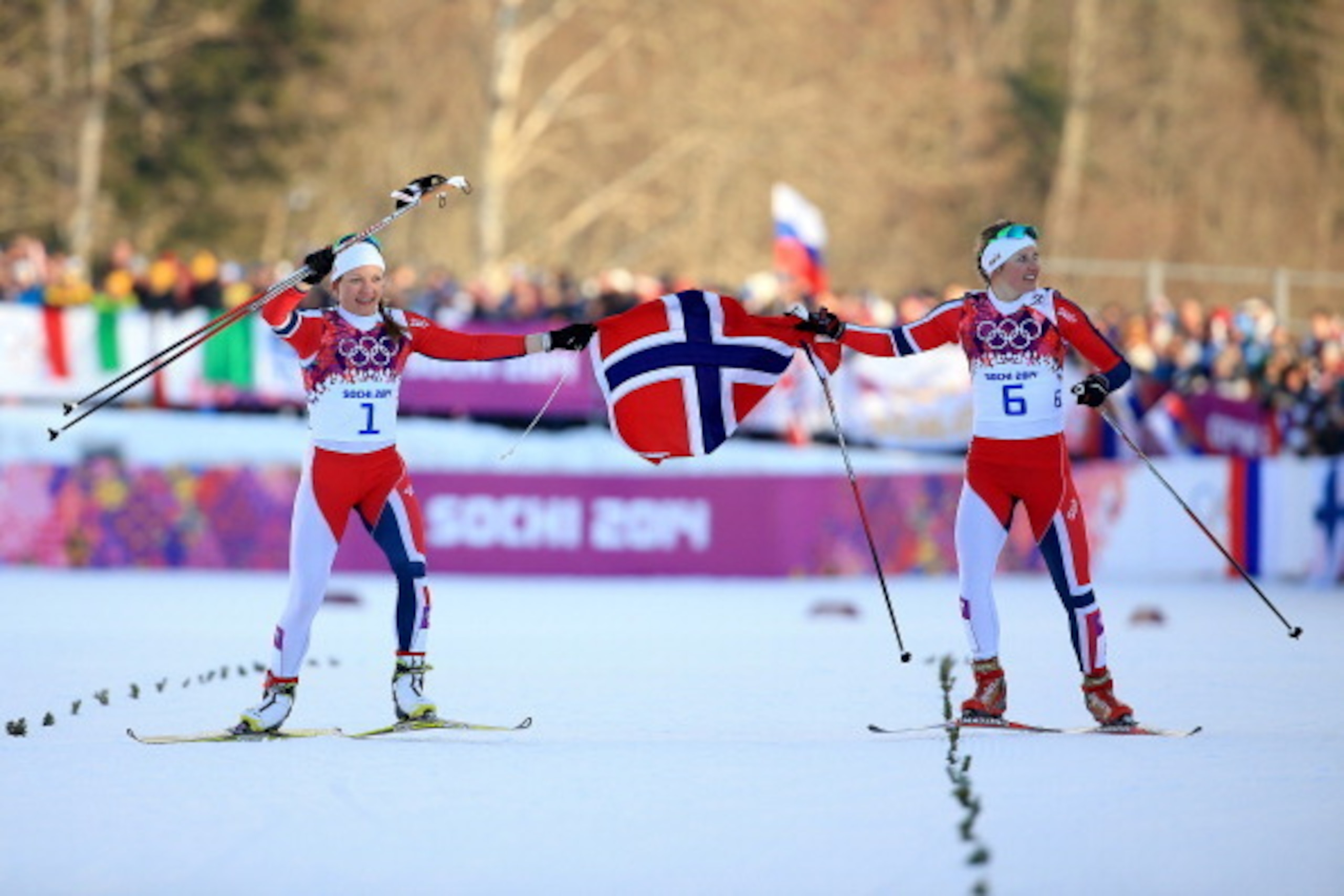 SOCHI, RUSSIA - FEBRUARY 11:  Maiken Caspersen Falla of Norway (L) and Ingvild Flugstad Oestberg of Norway celebrate winning first and second place in the Finals of the Ladies' Sprint Free during day four of the Sochi 2014 Winter Olympics at Laura Cross-c