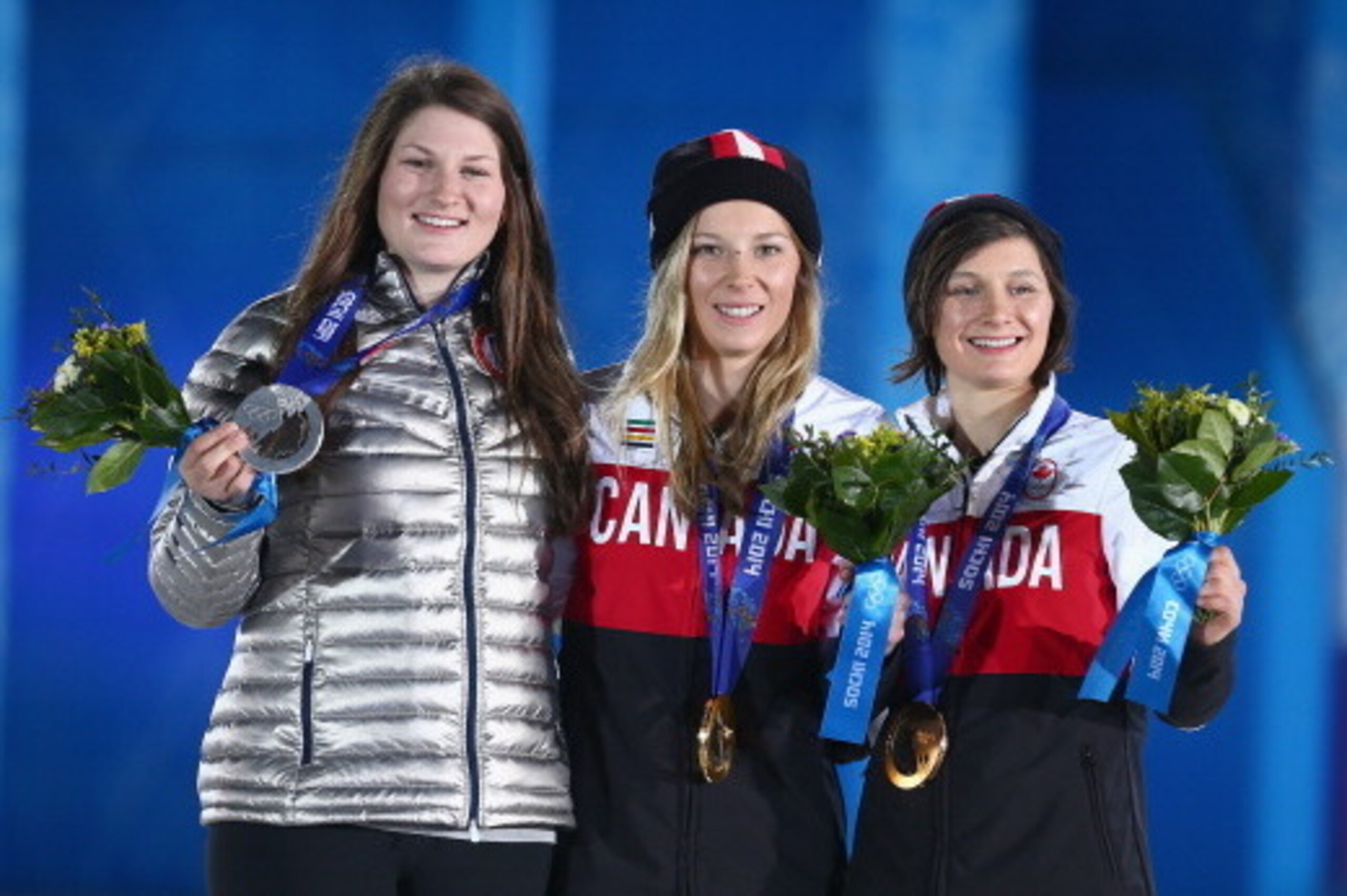 SOCHI, RUSSIA - FEBRUARY 11:  (L-R) Silver medalist Devin Logan of the United States, gold medalist Dara Howell of Canada and bronze medalist Kim Lamarre of Canada celebrate on the podium during the medal ceremony for the for the Freestyle Skiing Women's 