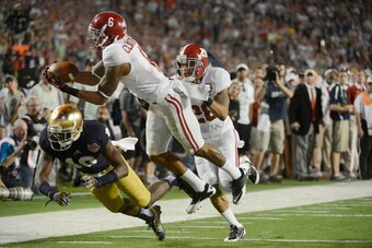Jan 7, 2013; Miami, FL, USA; Alabama Crimson Tide defensive back Ha'Sean Clinton-Dix (6) intercepts a pass intended for Notre Dame Fighting Irish wide receiver DaVaris Daniels (10) during the second half of the 2013 BCS Championship game at Sun Life Stadi