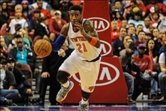 Jan 11, 2014; Philadelphia, PA, USA; New York Knicks shooting guard Iman Shumpert (21) moves the ball up court during the 2nd quarter of the game against the Philadelphia 76ers at the Wells Fargo Center. Mandatory Credit: John Geliebter-USA TODAY Sports