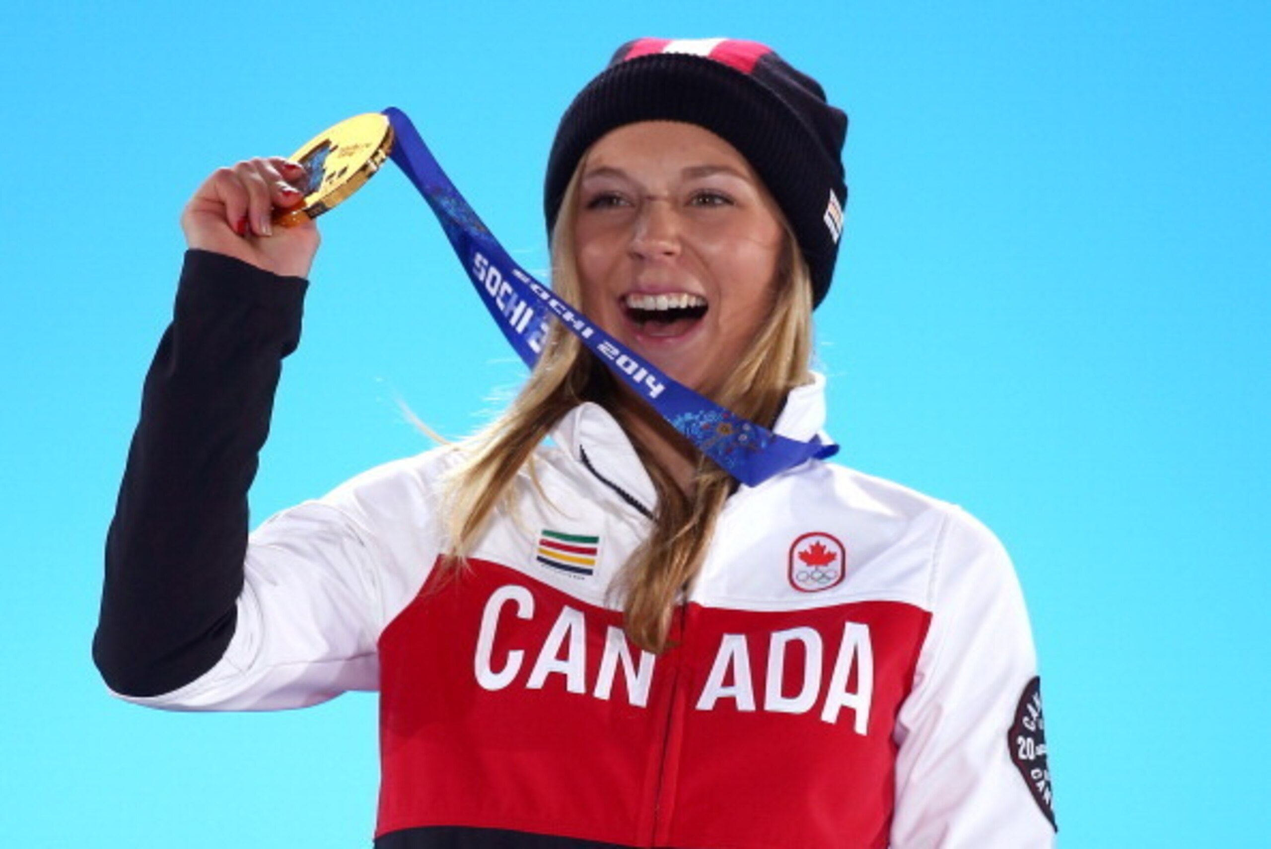 SOCHI, RUSSIA - FEBRUARY 11: Gold medalist Dara Howell of Canada celebrates during the medal ceremony for the Freestyle Skiing Women's Ski Slopestyle on day 4 of the Sochi 2014 Winter Olympics at Medals Plaza on February 11, 2014 in Sochi, Russia. (Phot SOCHI, RUSSIA - FEBRUARY 11: Gold medalist Dara Howell of Canada celebrates during the medal ceremony for the Freestyle Skiing Women's Ski Slopestyle on day 4 of the Sochi 2014 Winter Olympics at Medals Plaza on February 11, 2014 in Sochi, Russia. (Phot