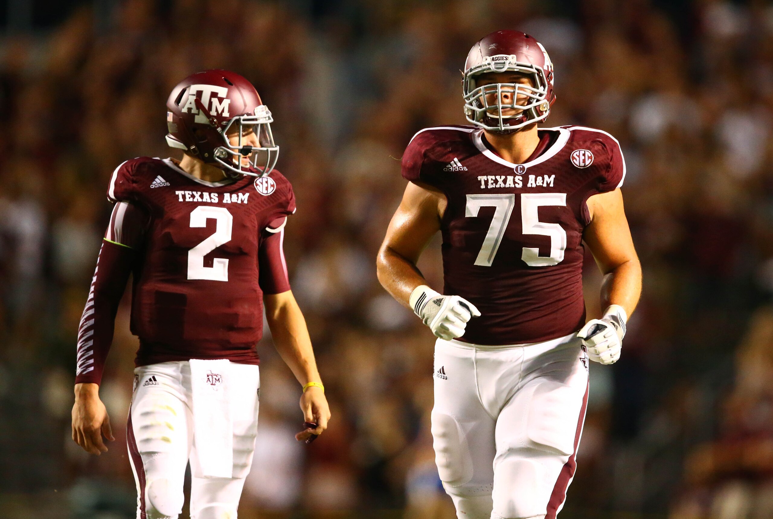 Sep 21, 2013; College Station, TX, USA; Texas A&M Aggies quarterback Johnny Manziel (2) and offensive lineman Jake Matthews against the SMU Mustangs at Kyle Field. Mandatory Credit: Mark J. Rebilas-USA TODAY Sports