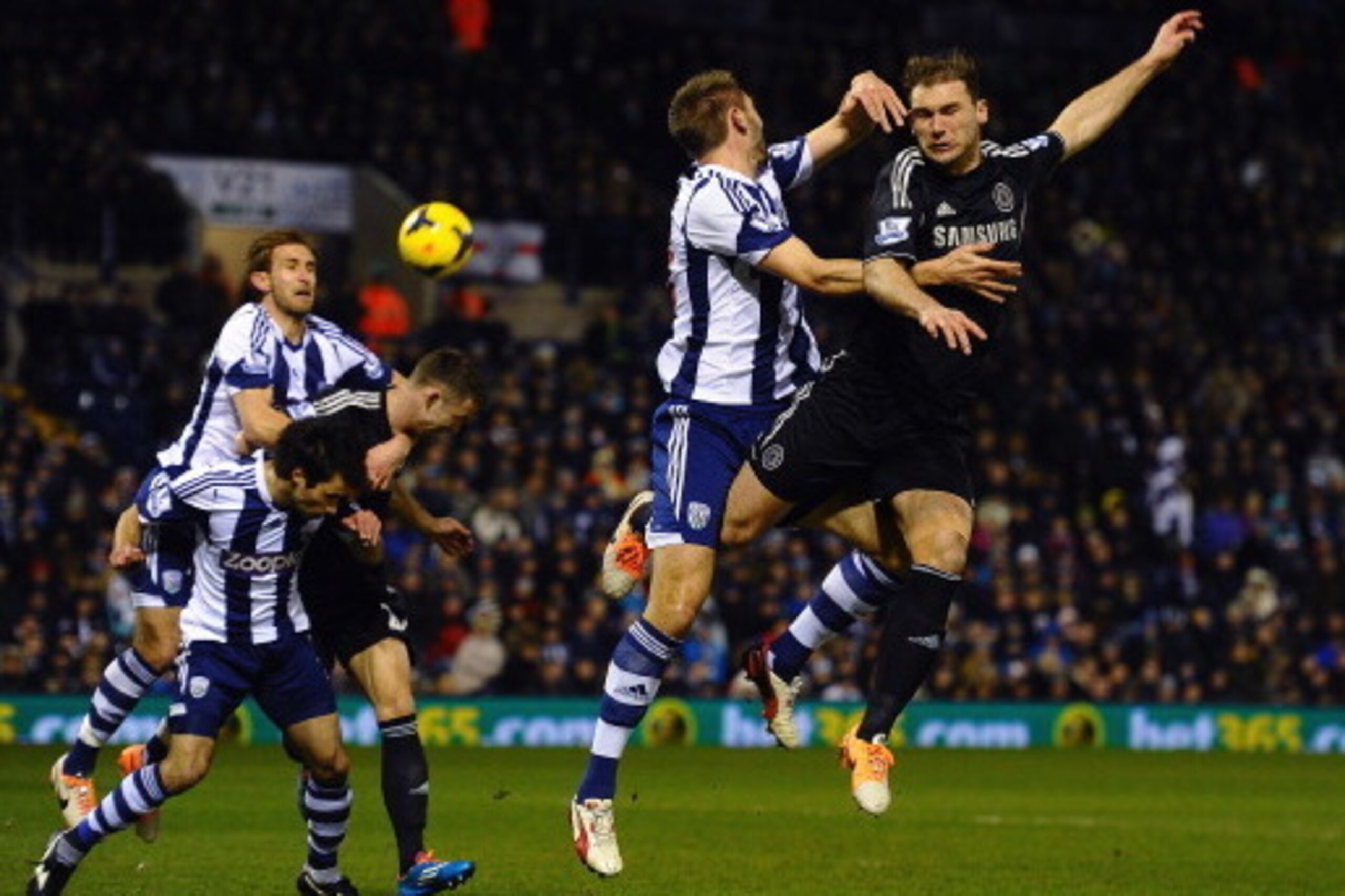 WEST BROMWICH, ENGLAND - FEBRUARY 11:  Gareth McAuley of West Brom and Branislav Ivanovic of Chelsea compete for the ball during the Barclays Premier League match between West Bromwich Albion and Chelsea at The Hawthorns on February 11, 2014 in West Bromw