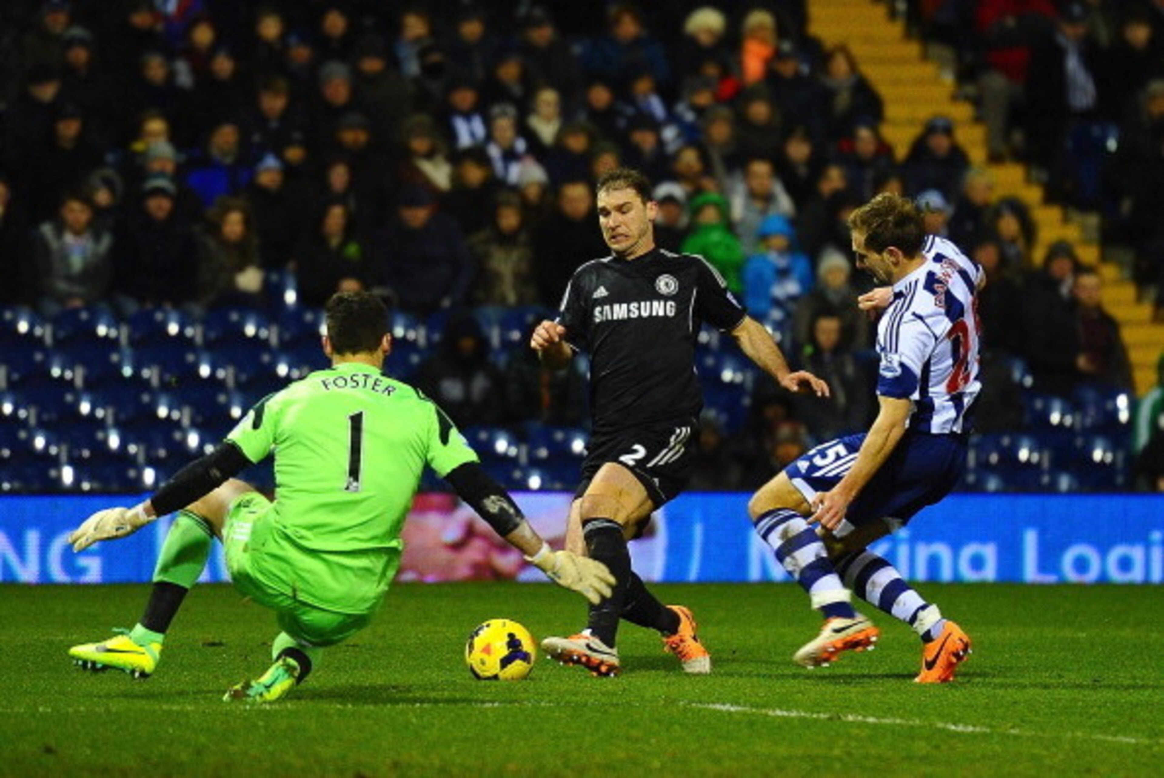 WEST BROMWICH, ENGLAND - FEBRUARY 11:  Branislav Ivanovic of Chelsea is closed down by Ben Foster and Craig Dawson of West Brom during the Barclays Premier League match between West Bromwich Albion and Chelsea at The Hawthorns on February 11, 2014 in West
