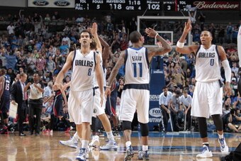 DALLAS, TX - OCTOBER 30: Monta Ellis #11, Shawn Marion #0 and Jose Calderon #8 of the Dallas Mavericks celebrate a win against the Atlanta Hawks on October 30, 2013 at the American Airlines Center in Dallas, Texas. NOTE TO USER: User expressly acknowledge