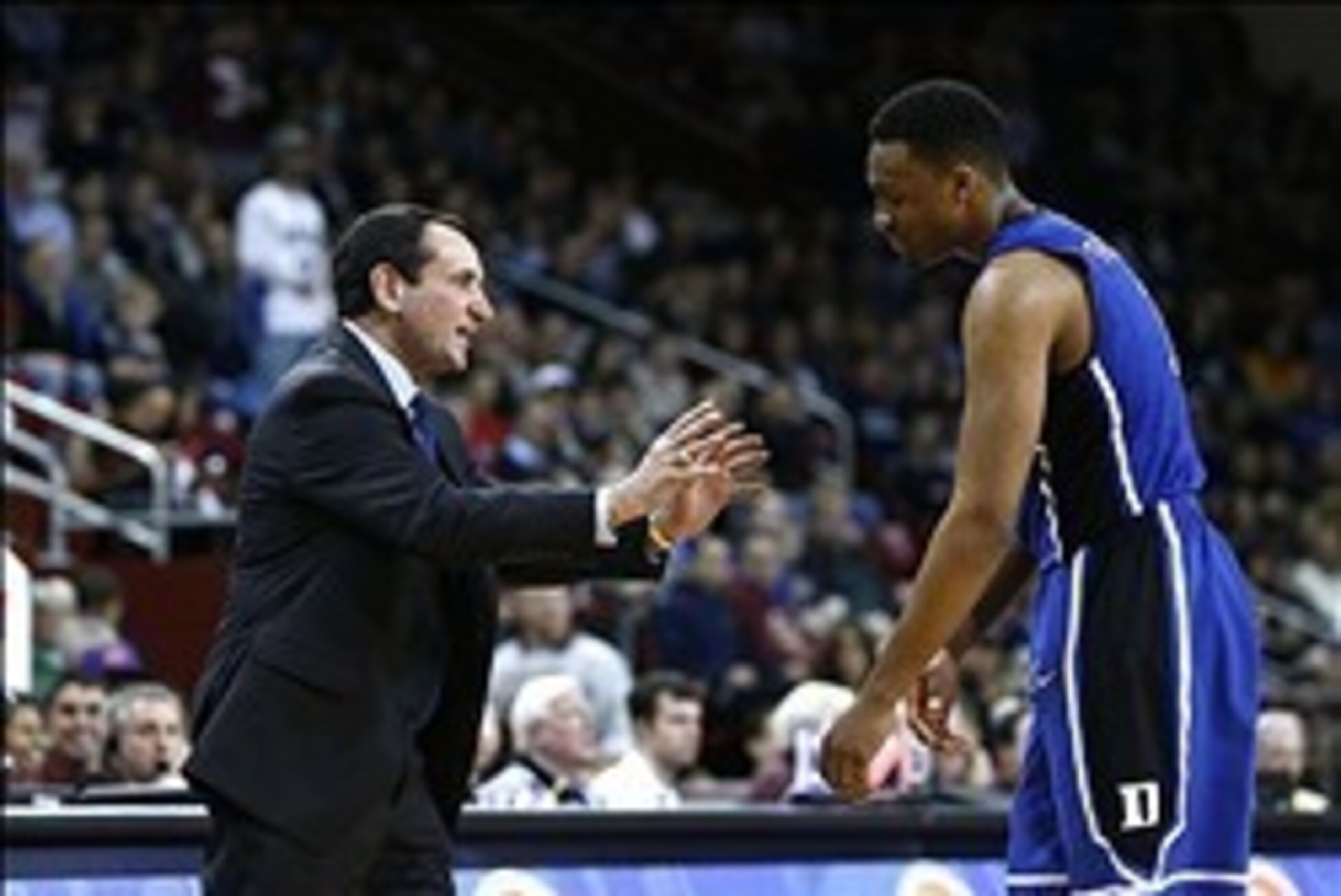Feb 8, 2014; Chestnut Hill, MA, USA; Duke Blue Devils head coach Mike Krzyzewski reacts to a foul called against forward Jabari Parker (1) during the second half of a game against the Boston College Eagles at Silvio O. Conte Forum. Mandatory Credit: Mark 