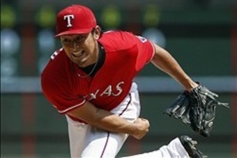 Sep 14, 2013; Arlington, TX, USA; Texas Rangers starting pitcher Yu Darvish (11) throws to the Oakland Athletics during the seventh inning of a baseball game at Rangers Ballpark in Arlington. The Athletics won 1-0. Mandatory Credit: Jim Cowsert-USA TODAY 