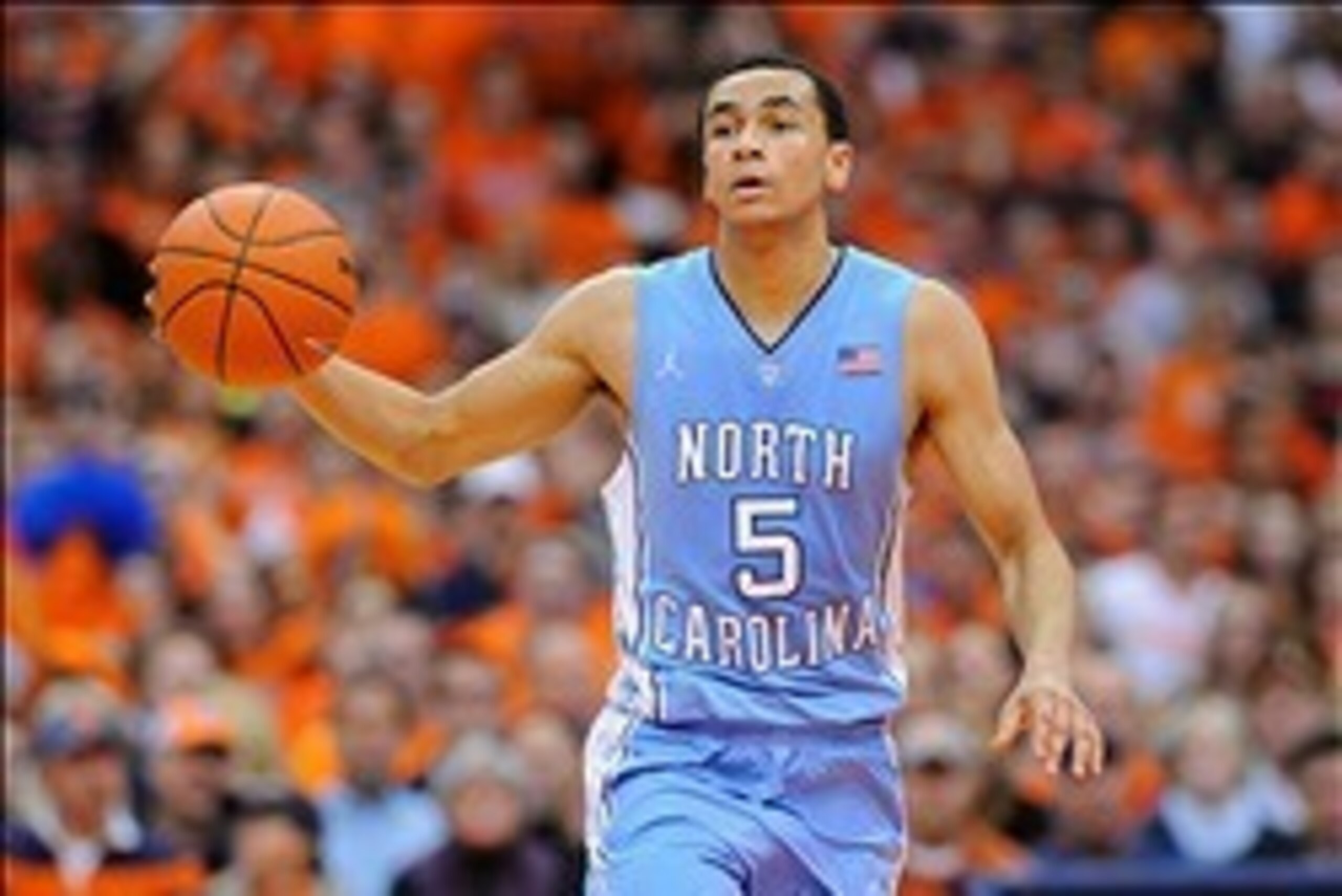 Jan 11, 2014; Syracuse, NY, USA; North Carolina Tar Heels guard Marcus Paige (5) dribbles the ball up the court against the Syracuse Orange during the second half at the Carrier Dome.  Syracuse defeated North Carolina 57-45.  Mandatory Credit: Rich Barnes
