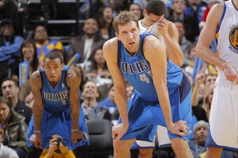 OAKLAND, CA - DECEMBER 11: Monta Ellis #11 and Dirk Nowitzki #41 of the Dallas Mavericks face off against the Golden State Warriors on December 11, 2013 at Oracle Arena in Oakland, California. NOTE TO USER: User expressly acknowledges and agrees that, by 