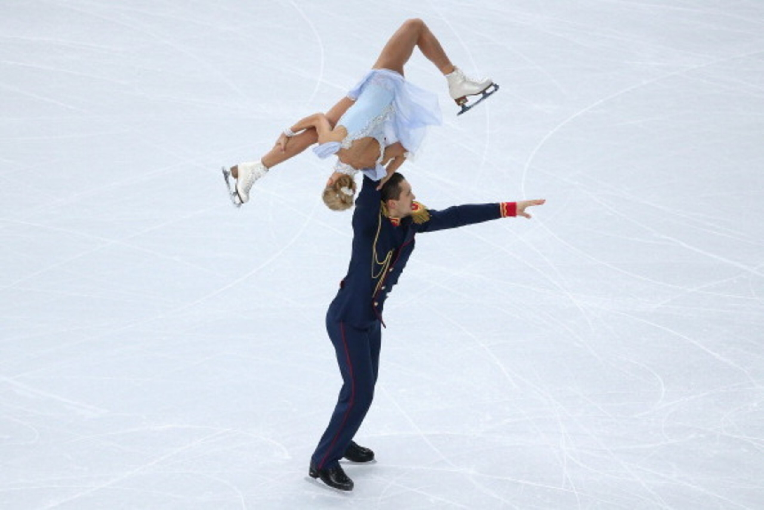 SOCHI, RUSSIA - FEBRUARY 06: Tatiana Volosozhar and Maxim Trankov of Russia compete in the Figure Skating Pairs Short Program during the Sochi 2014 Winter Olympics at Iceberg Skating Palace on February 6, 2014 in Sochi, Russia. (Photo by Robert Cianflo SOCHI, RUSSIA - FEBRUARY 06: Tatiana Volosozhar and Maxim Trankov of Russia compete in the Figure Skating Pairs Short Program during the Sochi 2014 Winter Olympics at Iceberg Skating Palace on February 6, 2014 in Sochi, Russia. (Photo by Robert Cianflo