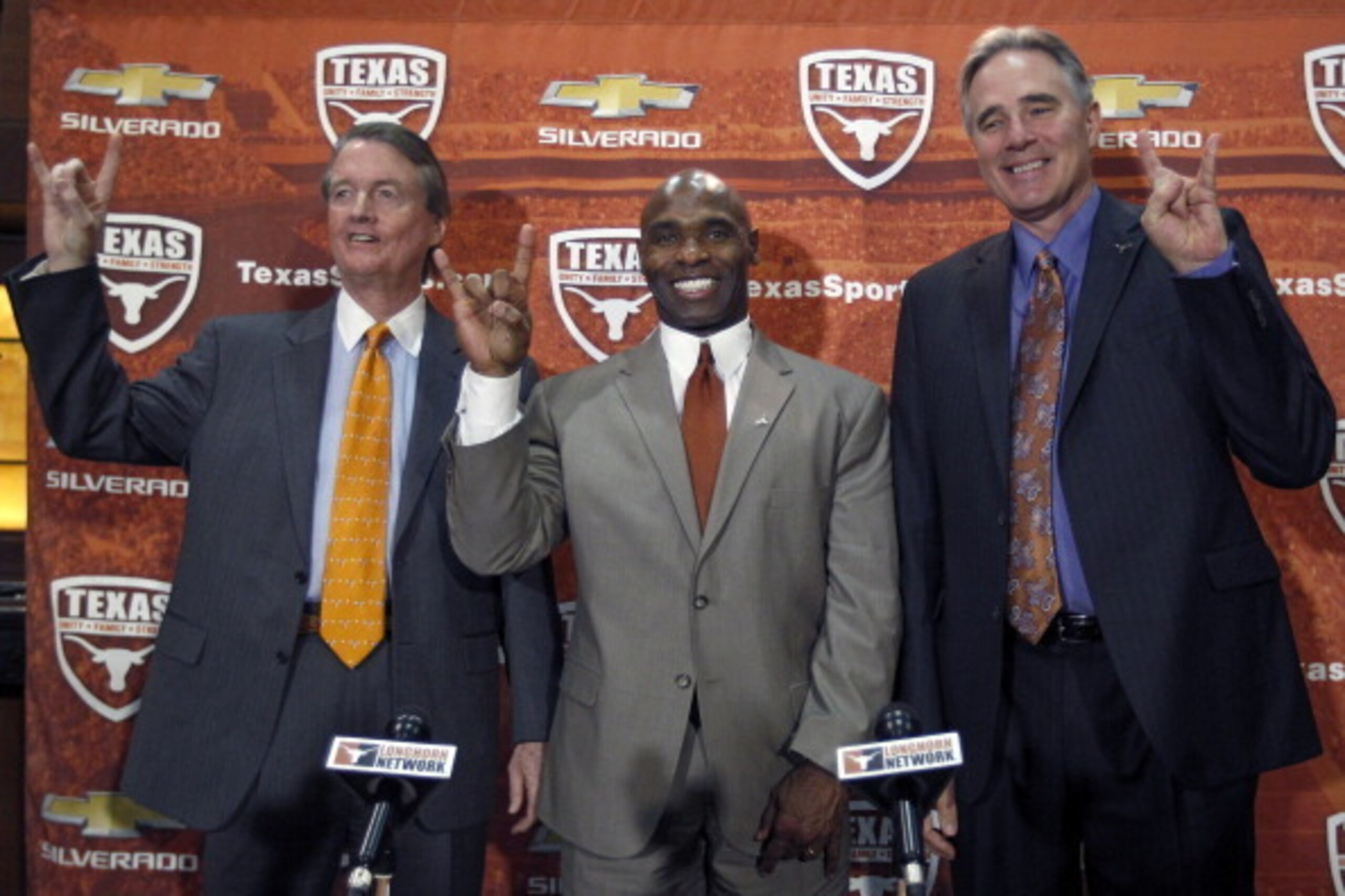 AUSTIN, TX - JANUARY 6:  University of Texas president Bill Powers, left and athletic director Steve Patterson, right, introduce new Longhorns head football coach Charlie Strong from Louisville during a press conference January 6, 2014 at Darrell K. Royal