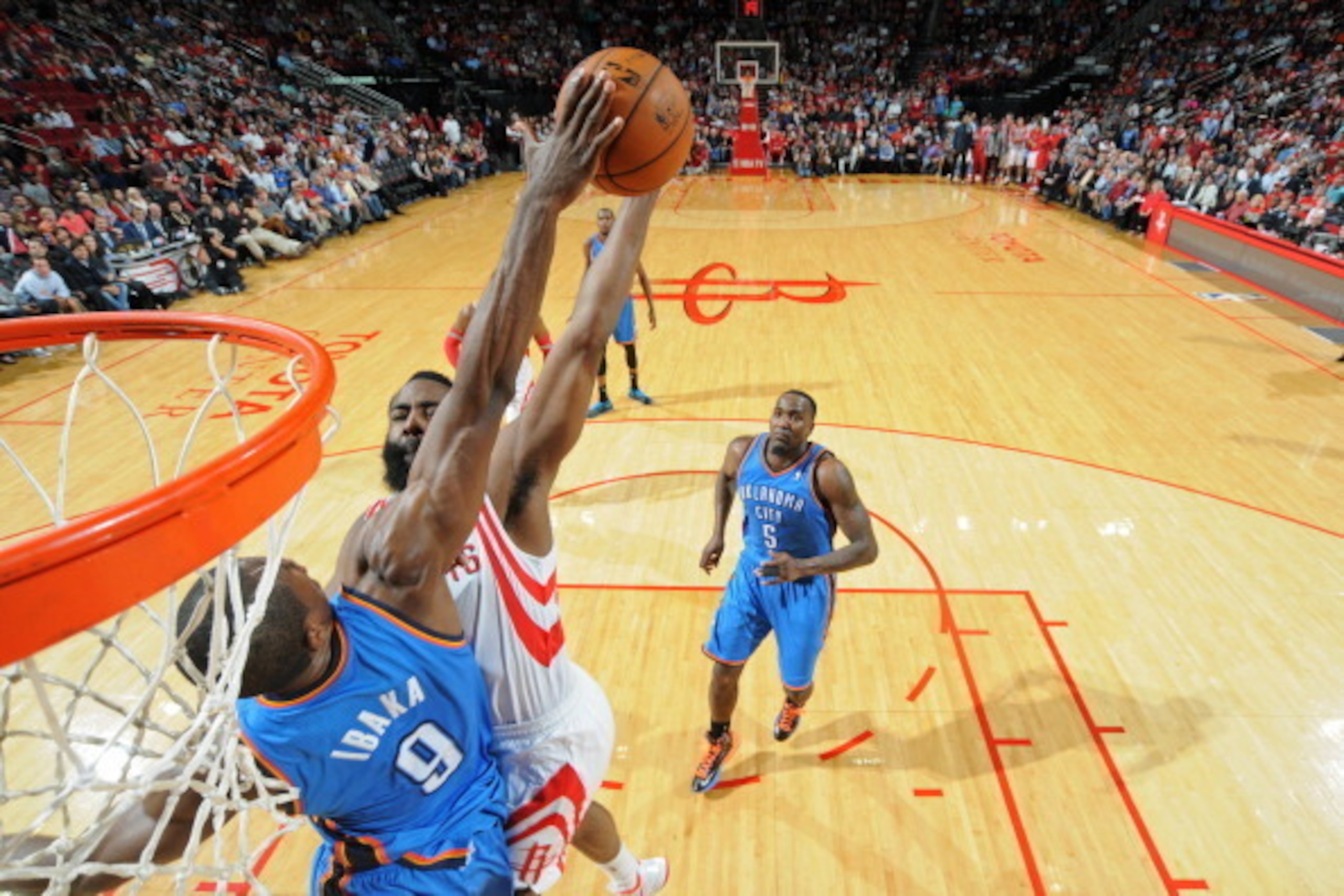 HOUSTON, TX - JANUARY 16:  James Harden #13 of the Houston Rockets gets his shot blocked by Serge Ibaka #9 of the Oklahoma City Thunder on January 16, 2014 at the Toyota Center in Houston, Texas. NOTE TO USER: User expressly acknowledges and agrees that, 