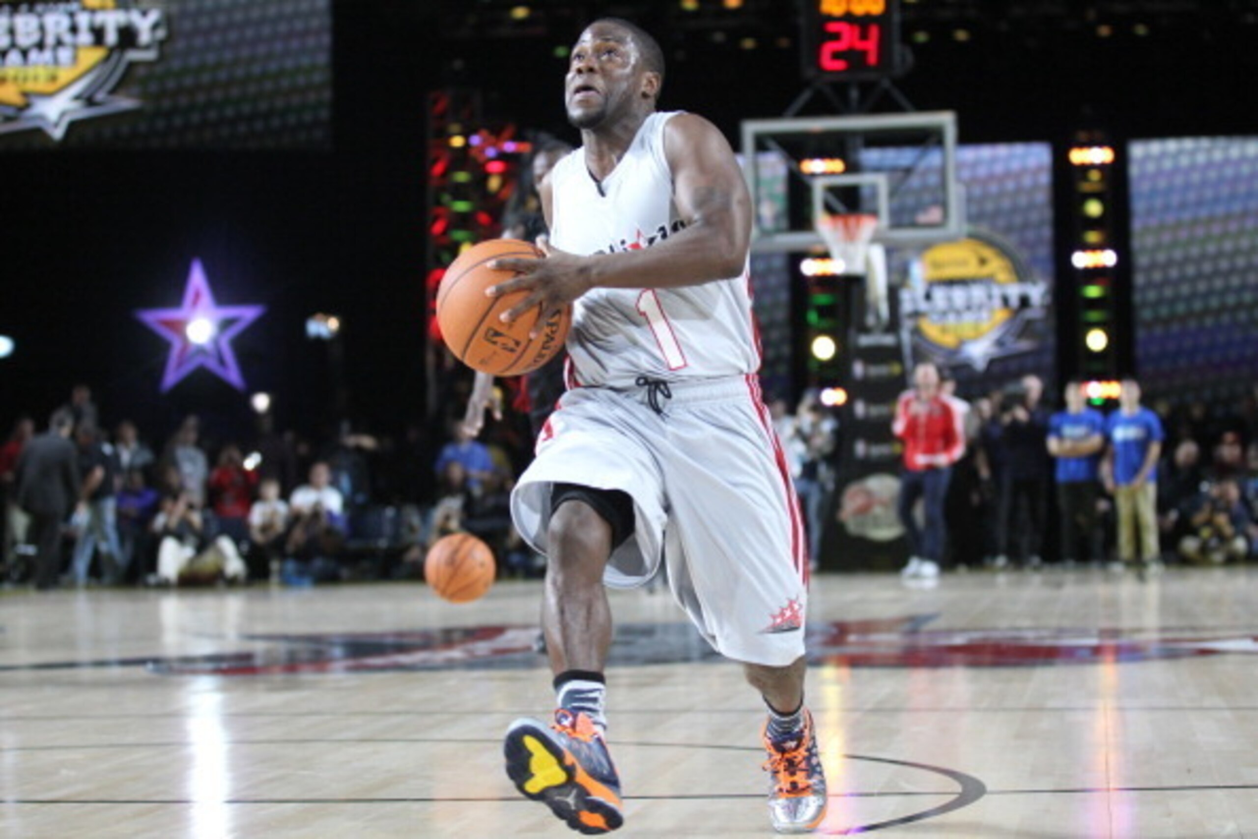 HOUSTON, TX - FEBRUARY 15: Comedian Kevin Hart challenges sprinter Usain Bolt to a race during the Sprint Celebrity Game at Jam Session during NBA All Star Weekend on February 15, 2013 at the George R. Brown in Houston, Texas.  NOTE TO USER: User expressl
