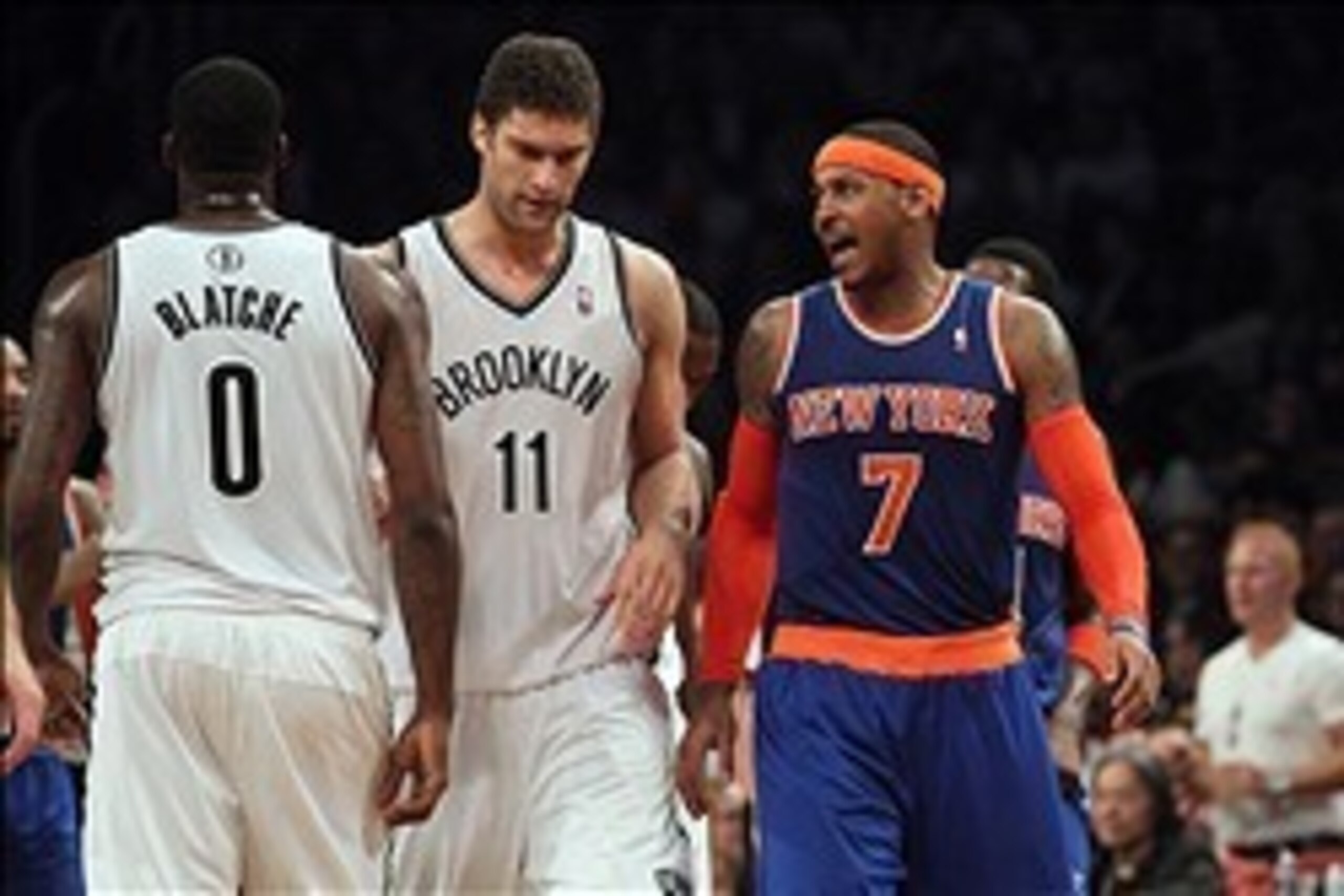 Dec 5, 2013; Brooklyn, NY, USA; New York Knicks small forward Carmelo Anthony (7) has words for Brooklyn Nets center Andray Blatche (0) as center Brook Lopez (11) attempts to get between them during the second quarter of a game at Barclays Center. Mandato Dec 5, 2013; Brooklyn, NY, USA; New York Knicks small forward Carmelo Anthony (7) has words for Brooklyn Nets center Andray Blatche (0) as center Brook Lopez (11) attempts to get between them during the second quarter of a game at Barclays Center. Mandato