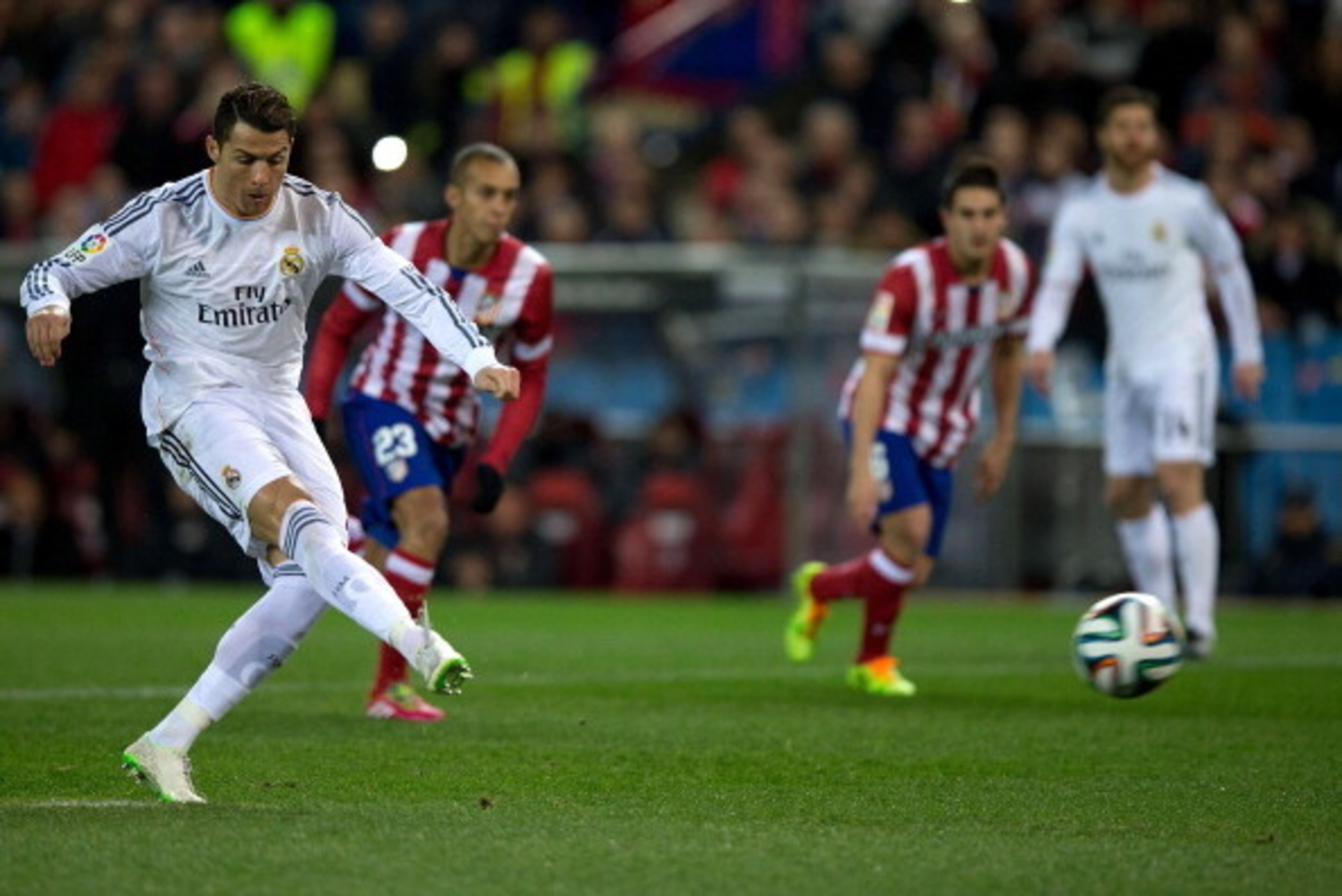 MADRID, SPAIN - FEBRUARY 11:  Cristiano Ronaldo of Real Madrid CF scores their opening goal from a penalty shot during the Copa del Rey semi-final second leg match between Club Atletico de Madrid and Real Madrid CF at Vicente Calderon Stadium on February 