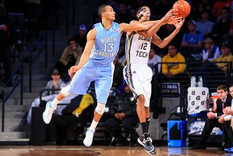 Jan 29, 2014; Atlanta, GA, USA; North Carolina Tar Heels forward J.P. Tokoto (13) fouls Georgia Tech Yellow Jackets forward Quinton Stephens (12) on an attempt to steal the ball in the first half at Hank McCamish Pavilion. Mandatory Credit: Daniel Shirey-