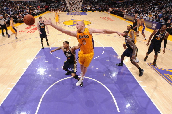 LOS ANGELES, CA - FEBRUARY 11: Chris Kaman #9 of the Los Angeles Lakers reaches for a rebound against the Utah Jazz at Staples Center on February 11, 2014 in Los Angeles, California. NOTE TO USER: User expressly acknowledges and agrees that, by downloadin