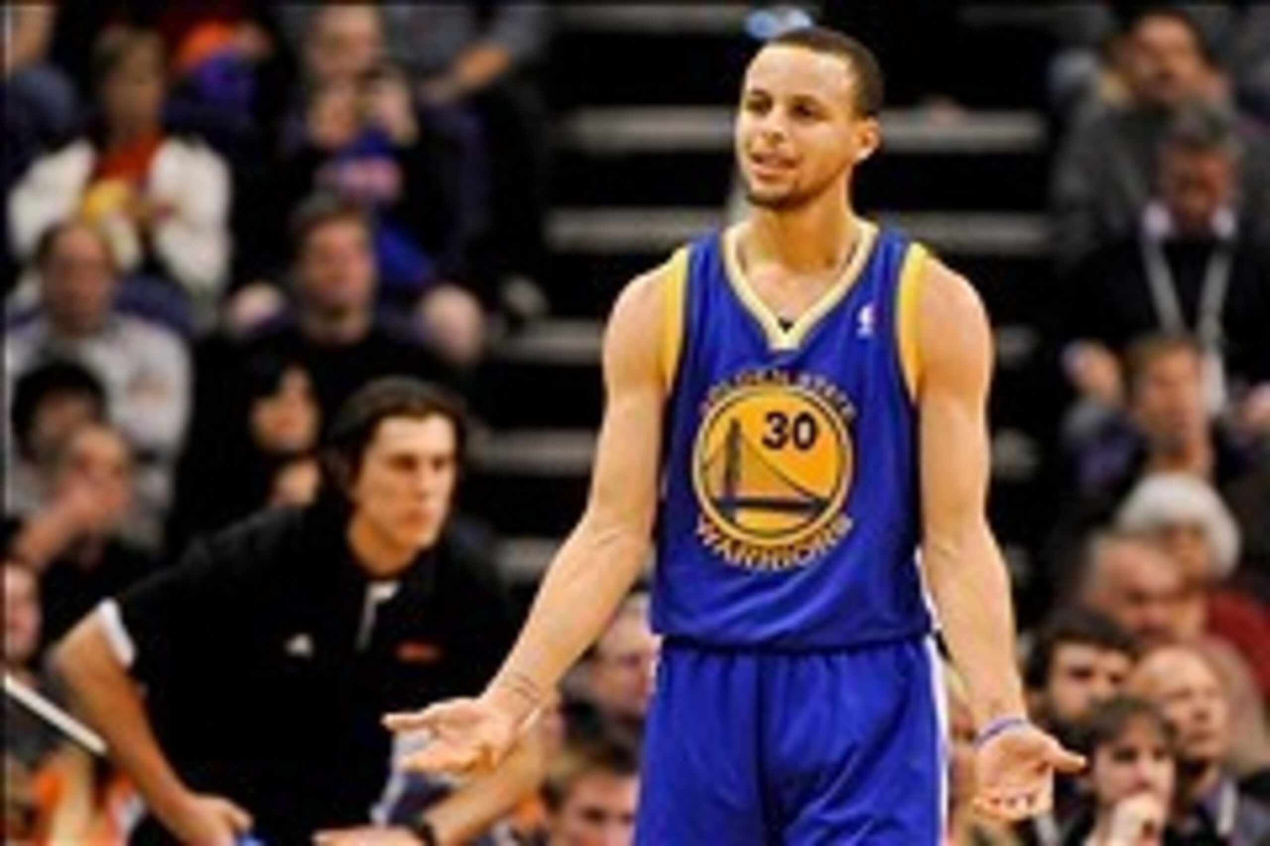 Feb 8, 2014; Phoenix, AZ, USA; Golden State Warriors guard Stephen Curry (30) reacts to a call during the second quarter against the Phoenix Suns at US Airways Center. The Suns won 122-109. Mandatory Credit: Casey Sapio-USA TODAY Sports