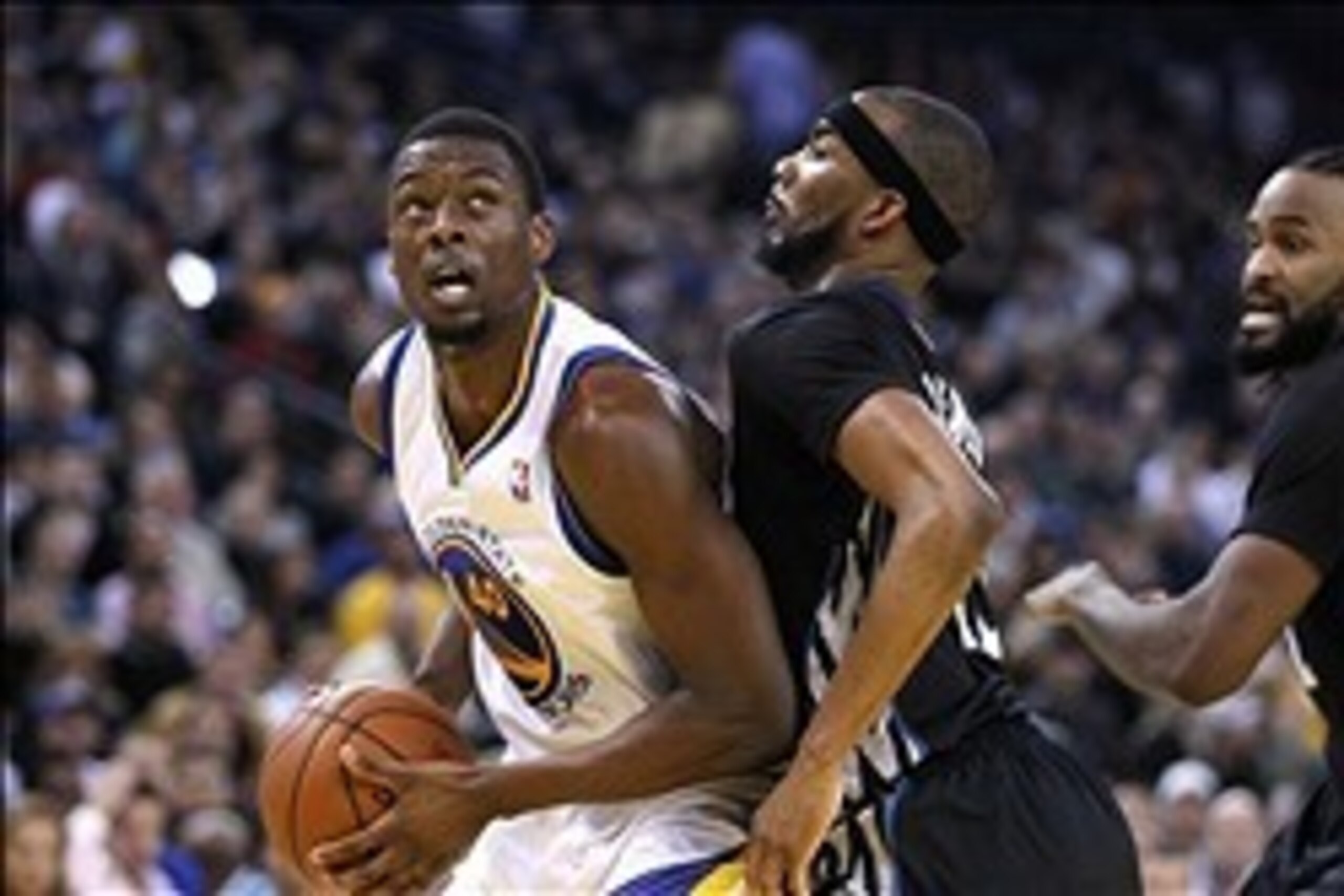 Jan 24, 2014; Oakland, CA, USA; Golden State Warriors forward Harrison Barnes (40) looks for room to shoot the ball next to Minnesota Timberwolves forward Corey Brewer (13) in the third quarter at Oracle Arena. The Timberwolves defeated the Warriors 121-1