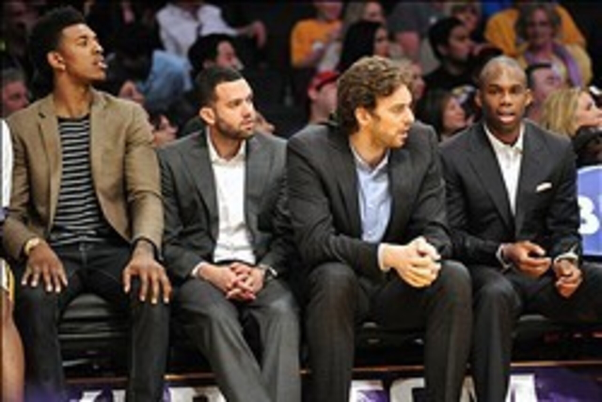 February 9, 2014; Los Angeles, CA, USA; Injured Los Angeles Lakers small forward Nick Young, point guard Jordan Farmar, center Pau Gasol and shooting guard Jodie Meeks watch game action against the Chicago Bulls during the second half at Staples Center. M